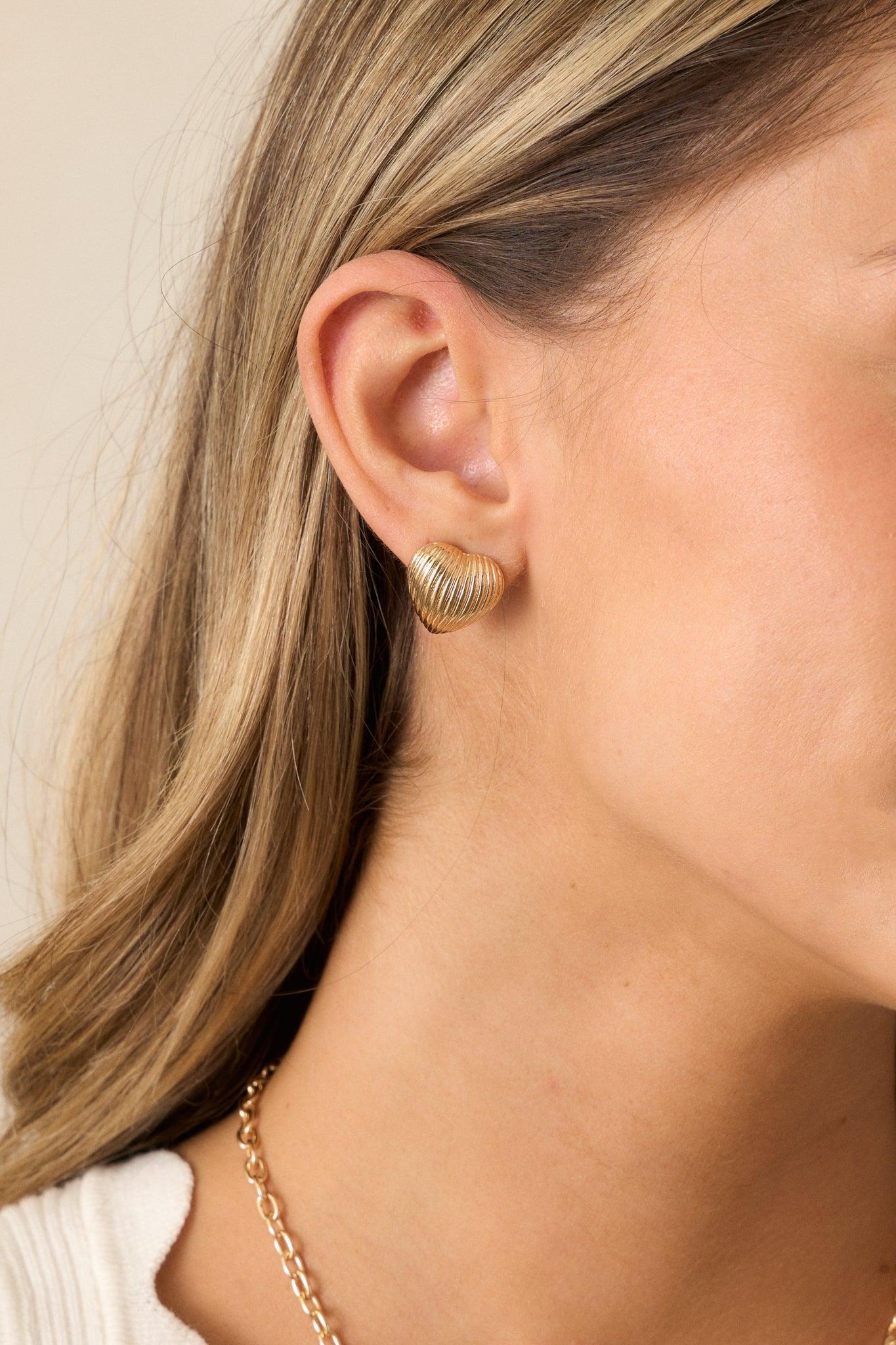 The Whispering Chasm Gold Textured Heart Earrings Product Image