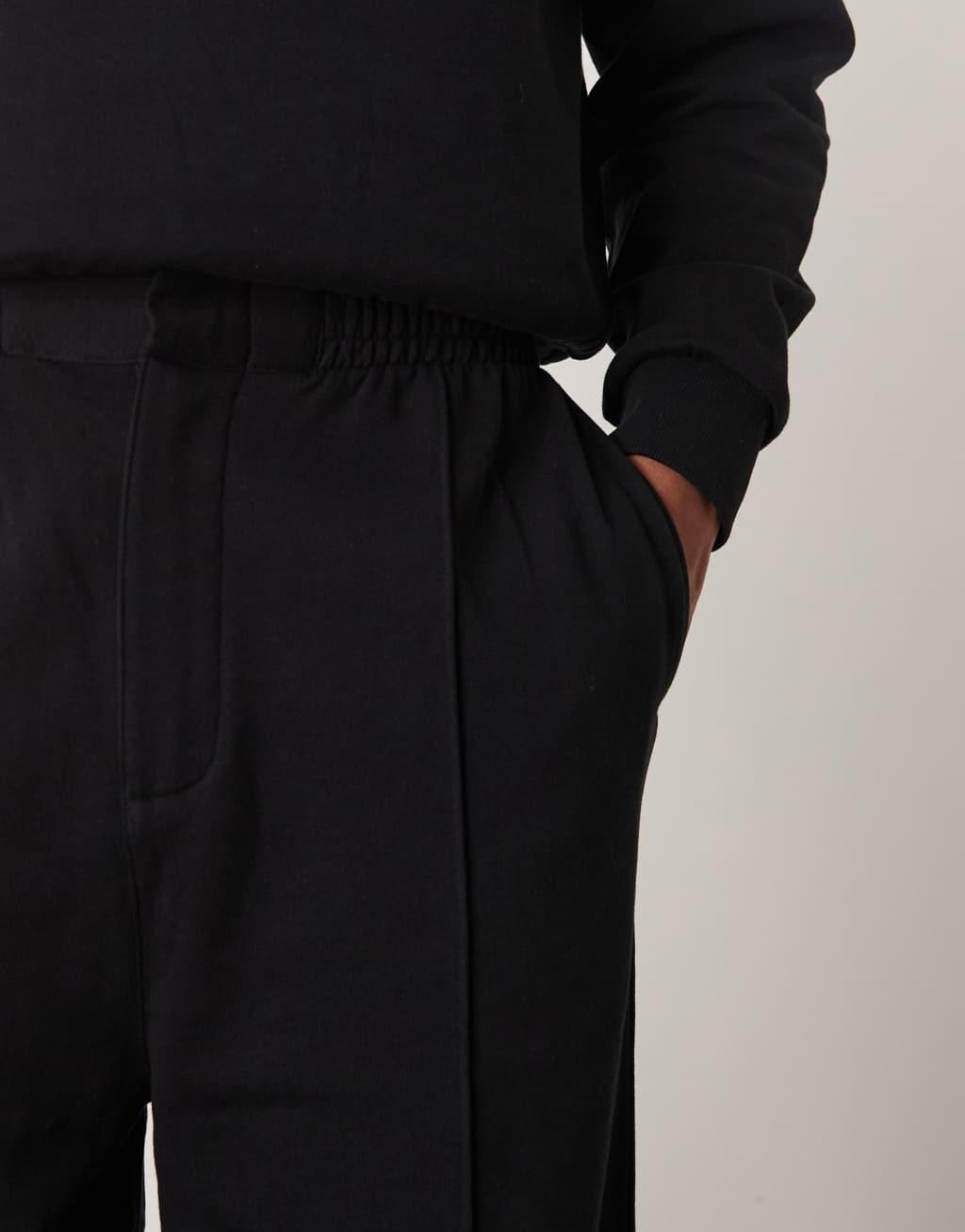 ASOS DESIGN wide leg sweatpants with pin tucks and zip fastening in black Product Image