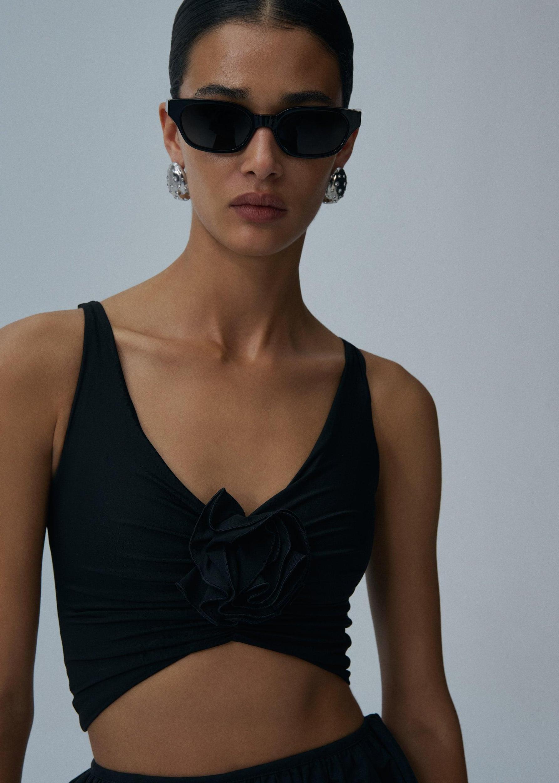 Ruched flower top in black Product Image