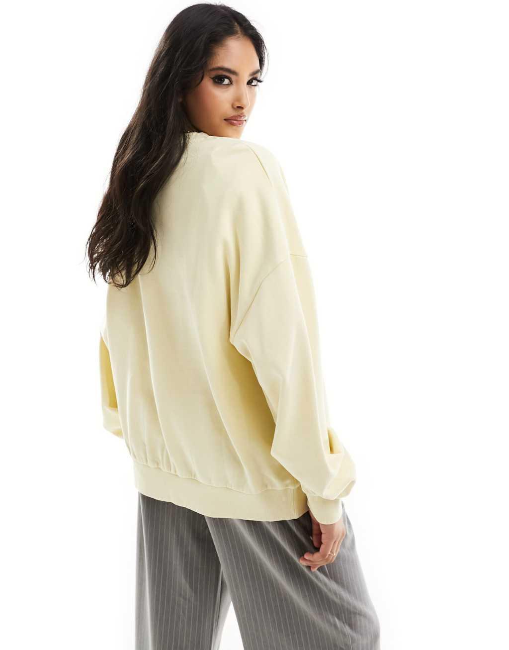 ASOS DESIGN oversized sweatshirt in washed lemon Product Image