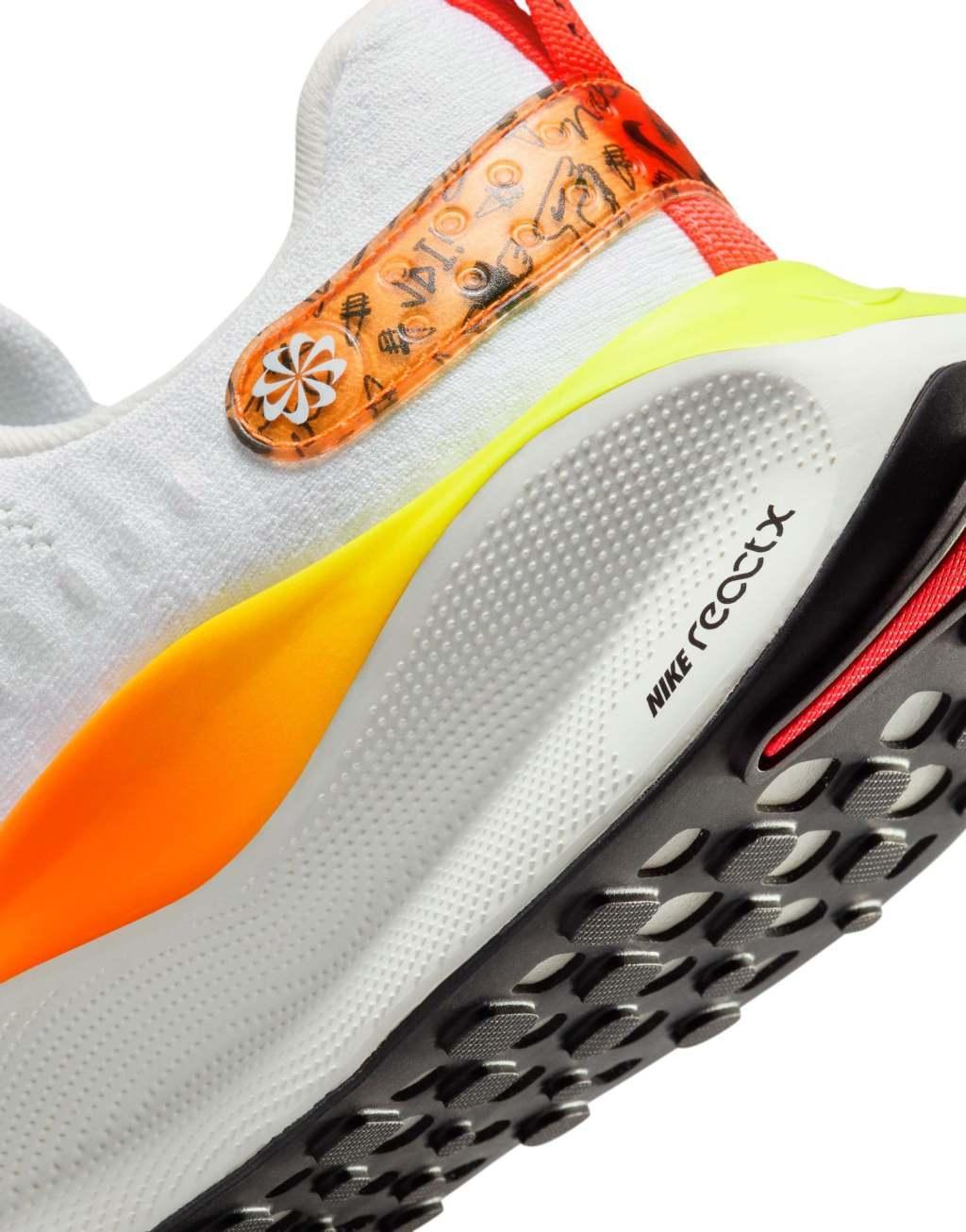 Nike Running Infinity Run X sneakers in white and orange ombre Product Image