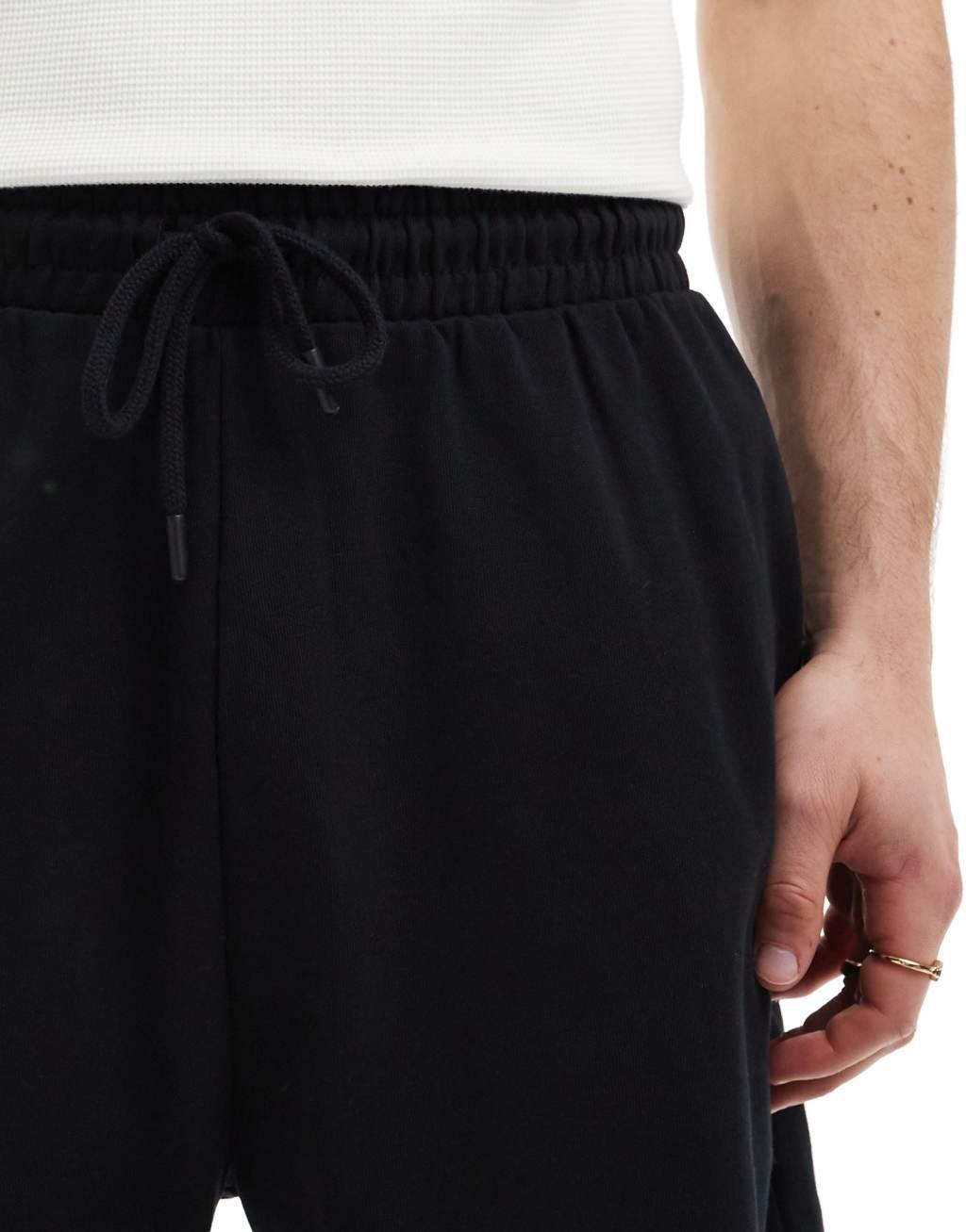 ASOS DESIGN oversized shorts in black Product Image