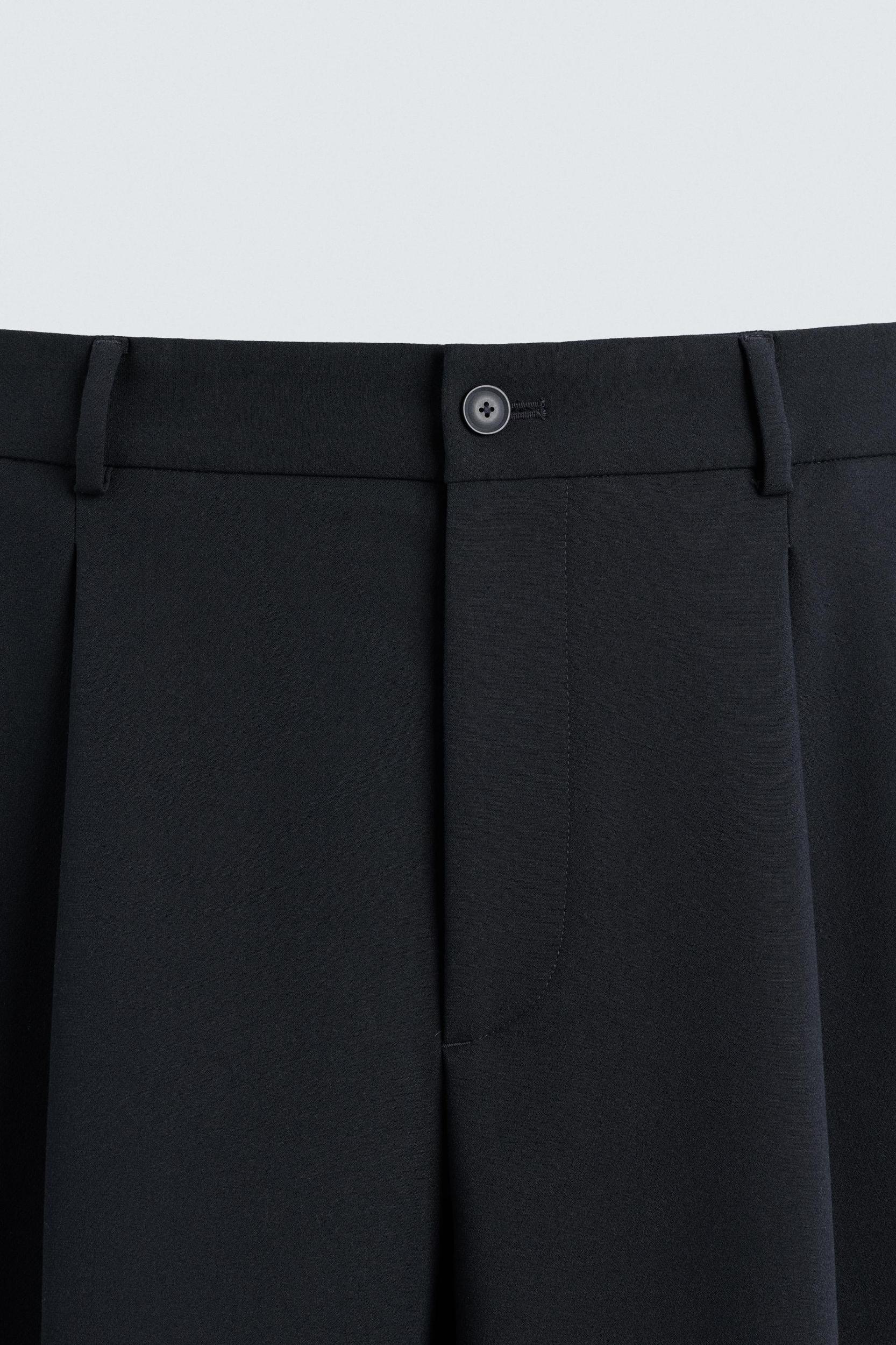 RELAXED FIT PLEATED PANTS Product Image