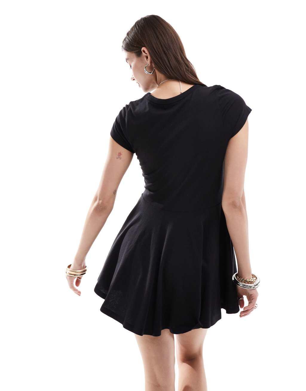 Monki short sleeve mini jersey dress with an a-line skirt in black Product Image