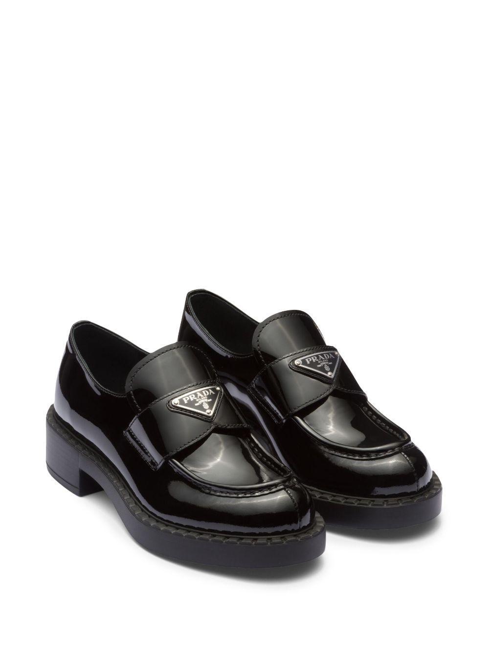 PRADA Enamel Triangle Logo Plaque Loafers In Nero Product Image