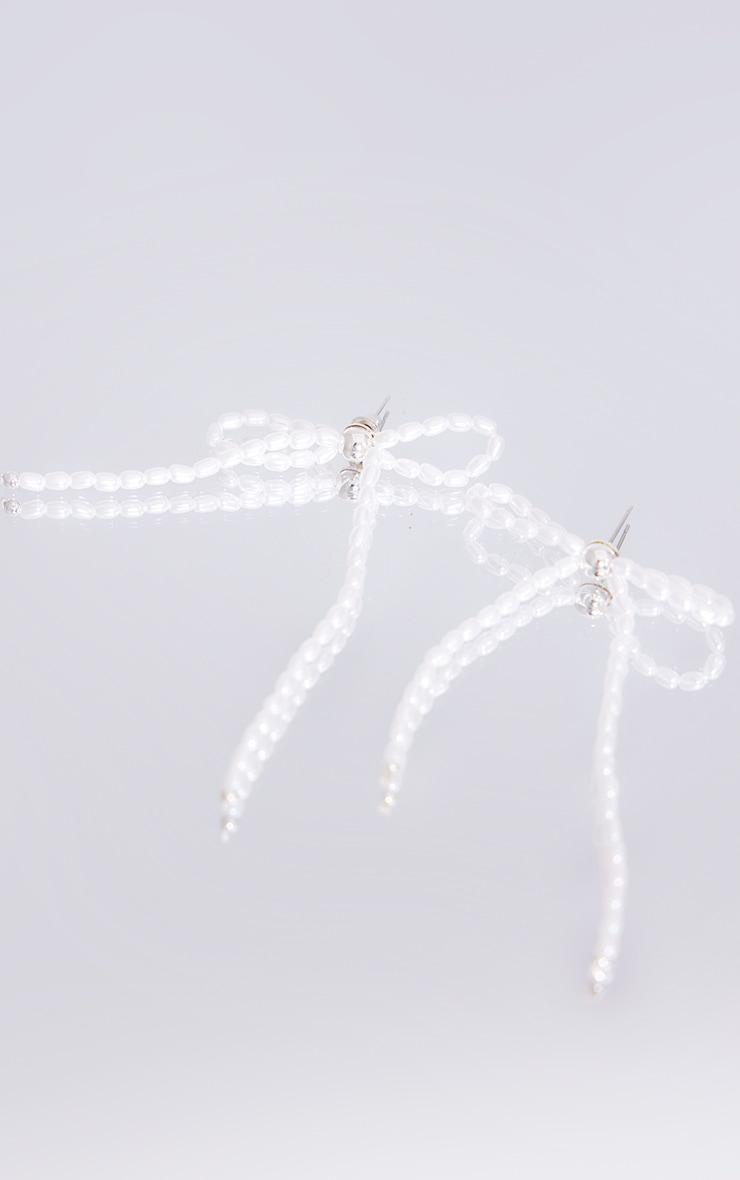 Silver Beaded Bow Tassel Earrings Product Image