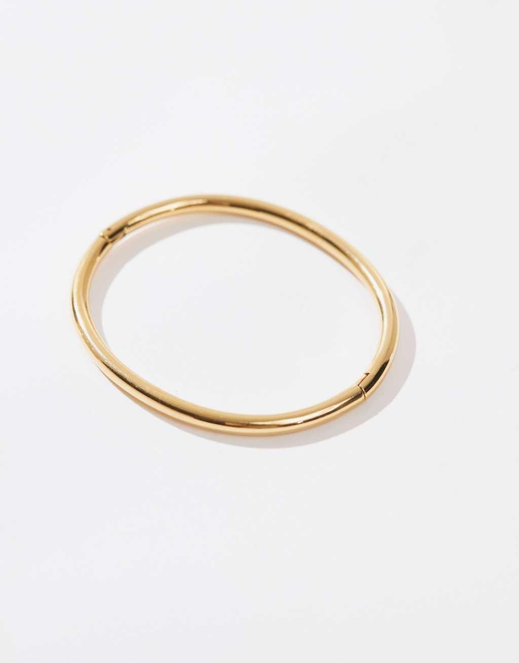 ASOS DESIGN Curve waterproof stainless steel simple bangle in gold tone Product Image