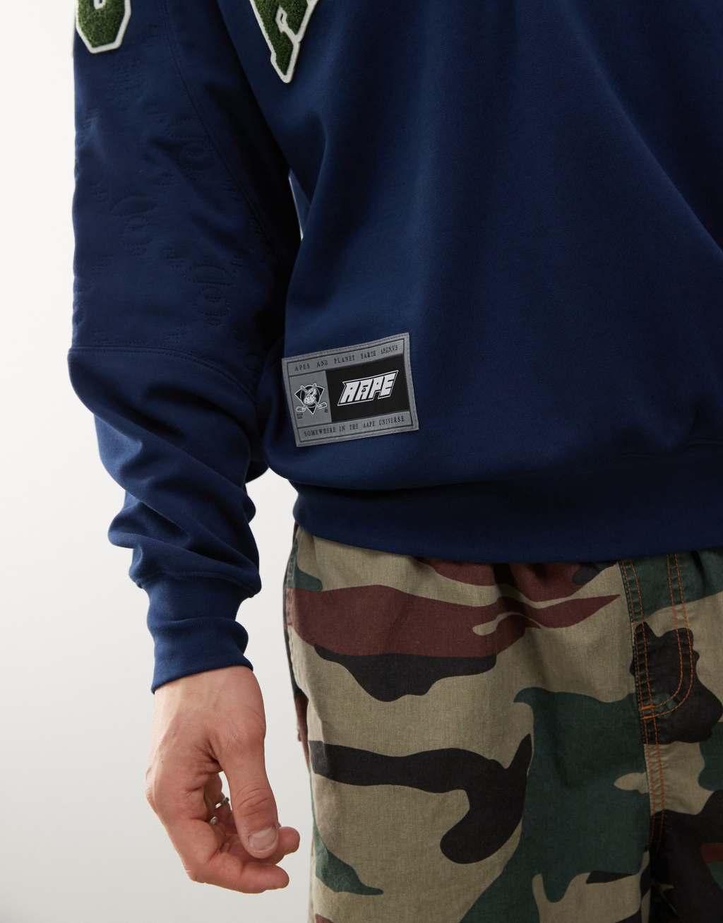 Aape by A Bathing Ape logo college sweatshirt in navy Product Image