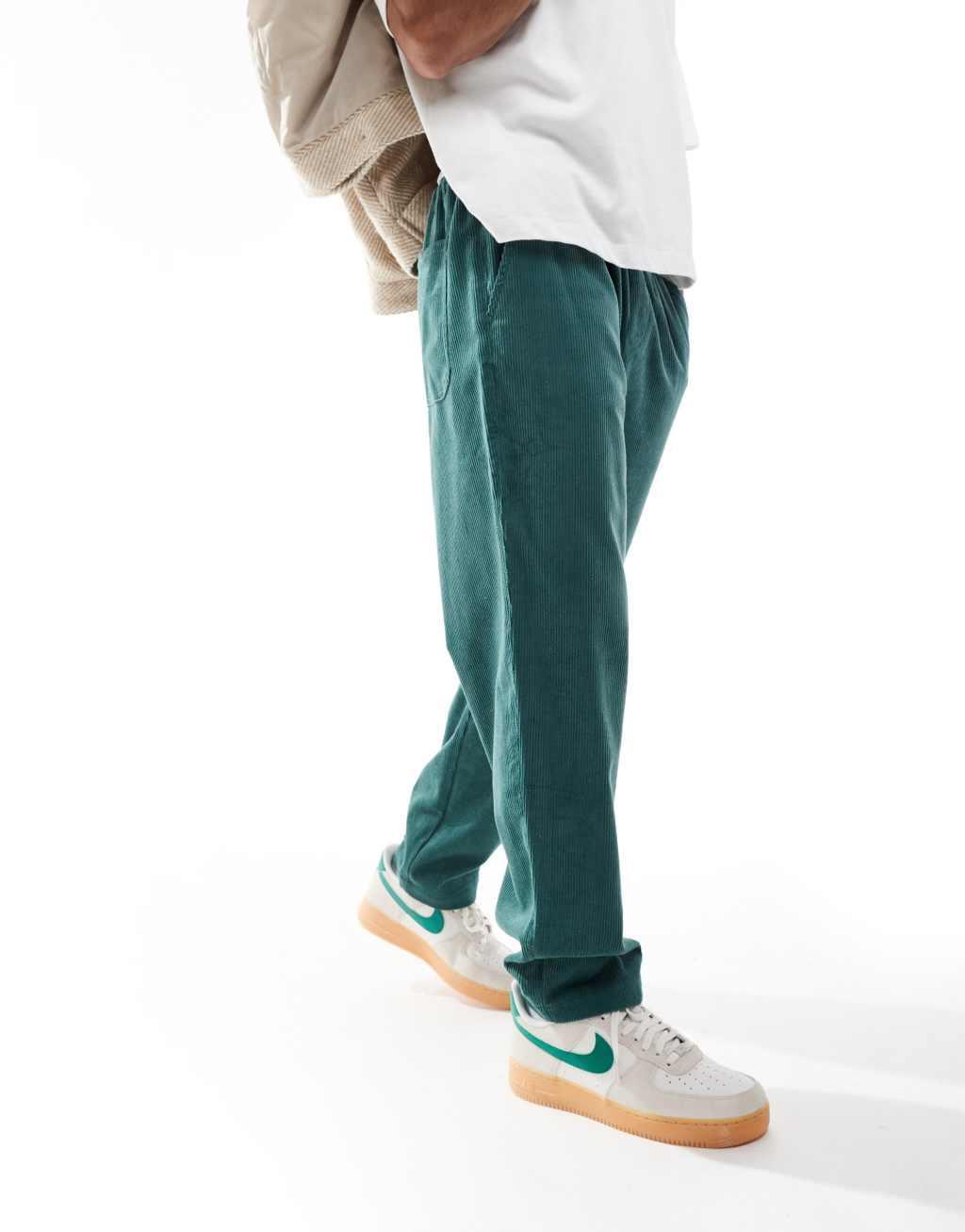 ASOS DESIGN tapered cord pants in green Product Image