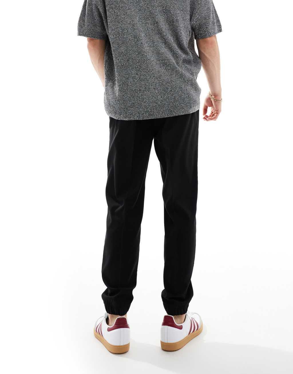 ASOS DESIGN tapered smart pants with sweatpants cuff in black Product Image