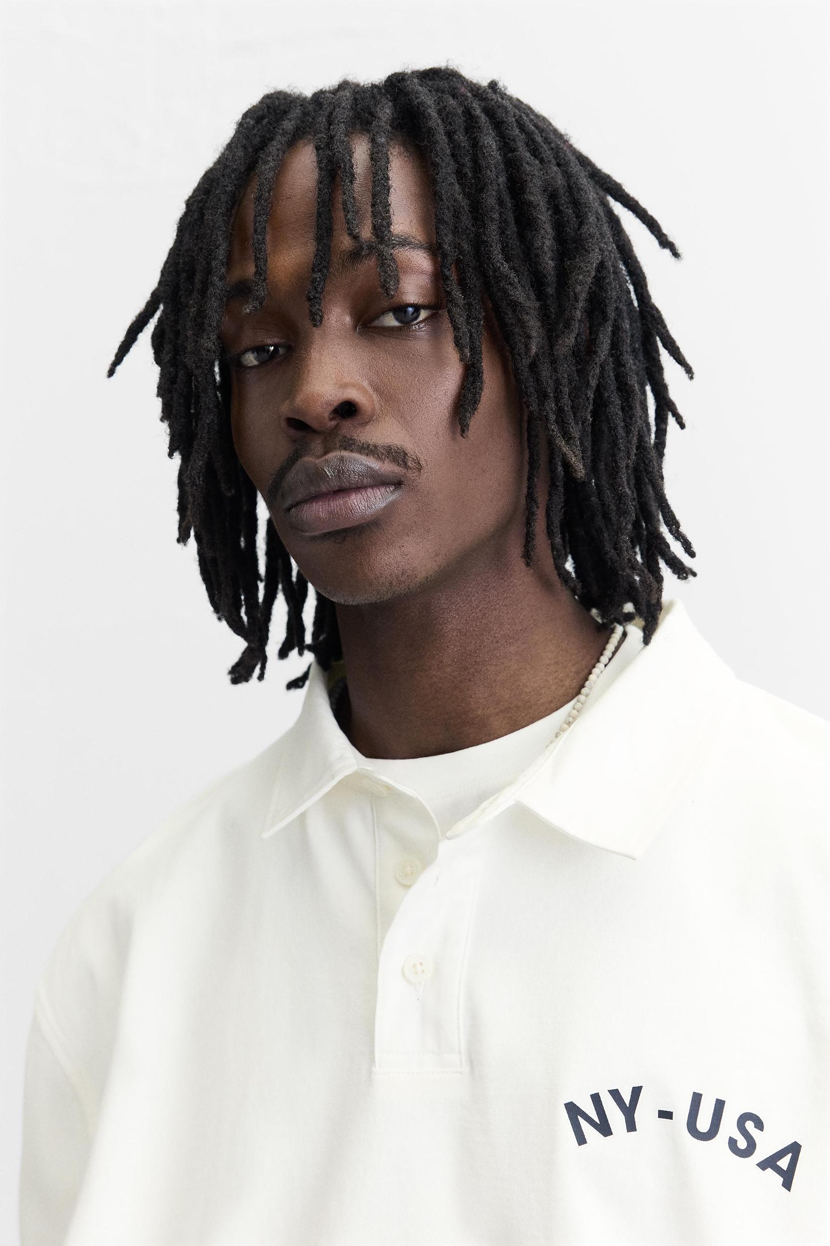 POLO WITH CONTRASTING SIDE STRIPE Product Image