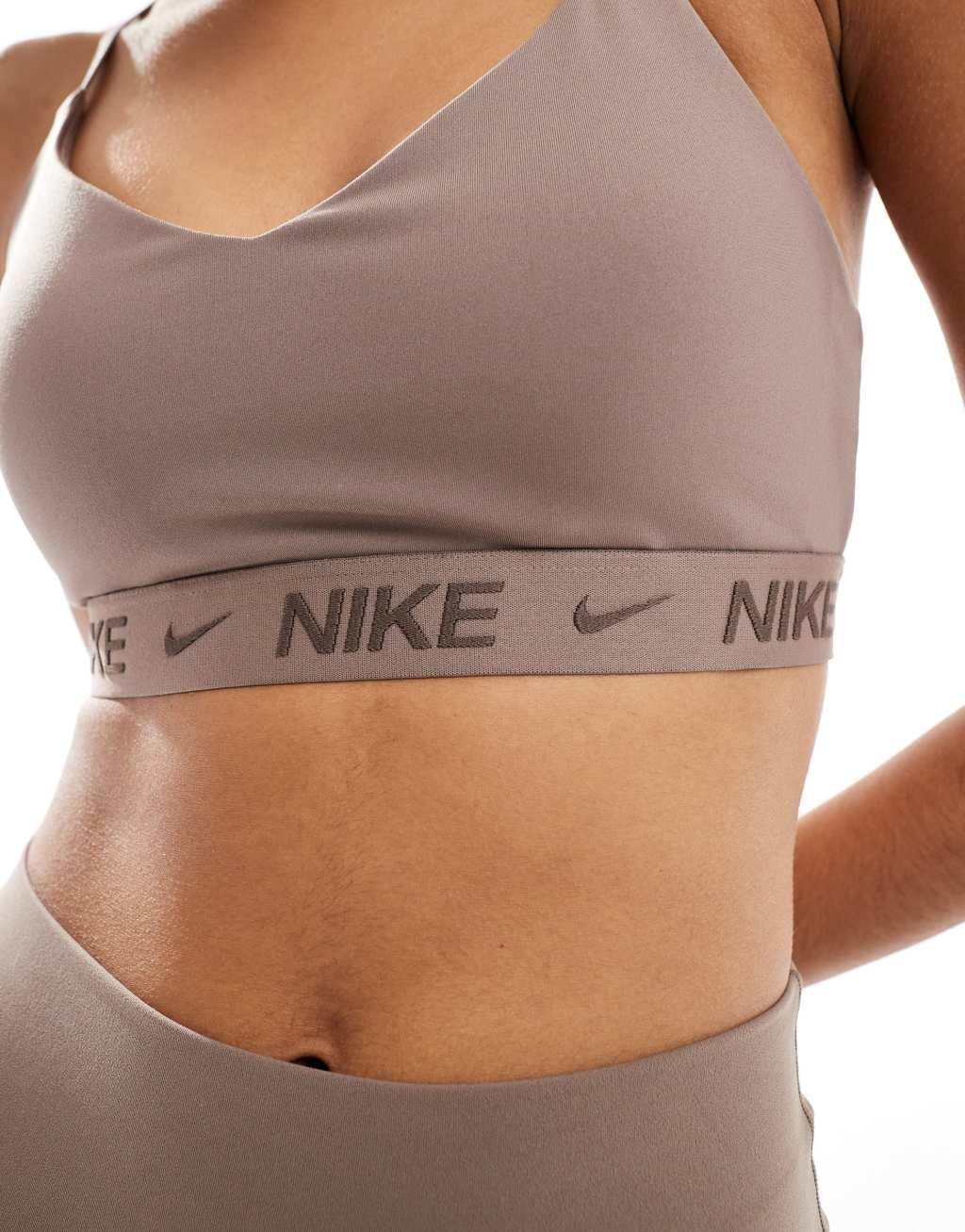 Nike Training Indy light support sports bra in brown Product Image