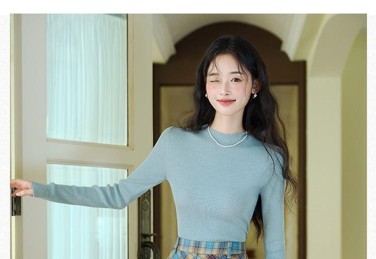 Long-Sleeve Mock Neck Plain Knit Top / V-Neck Cardigan / High Waist Plaid Pleated Midi A-Line Skirt / Set Product Image