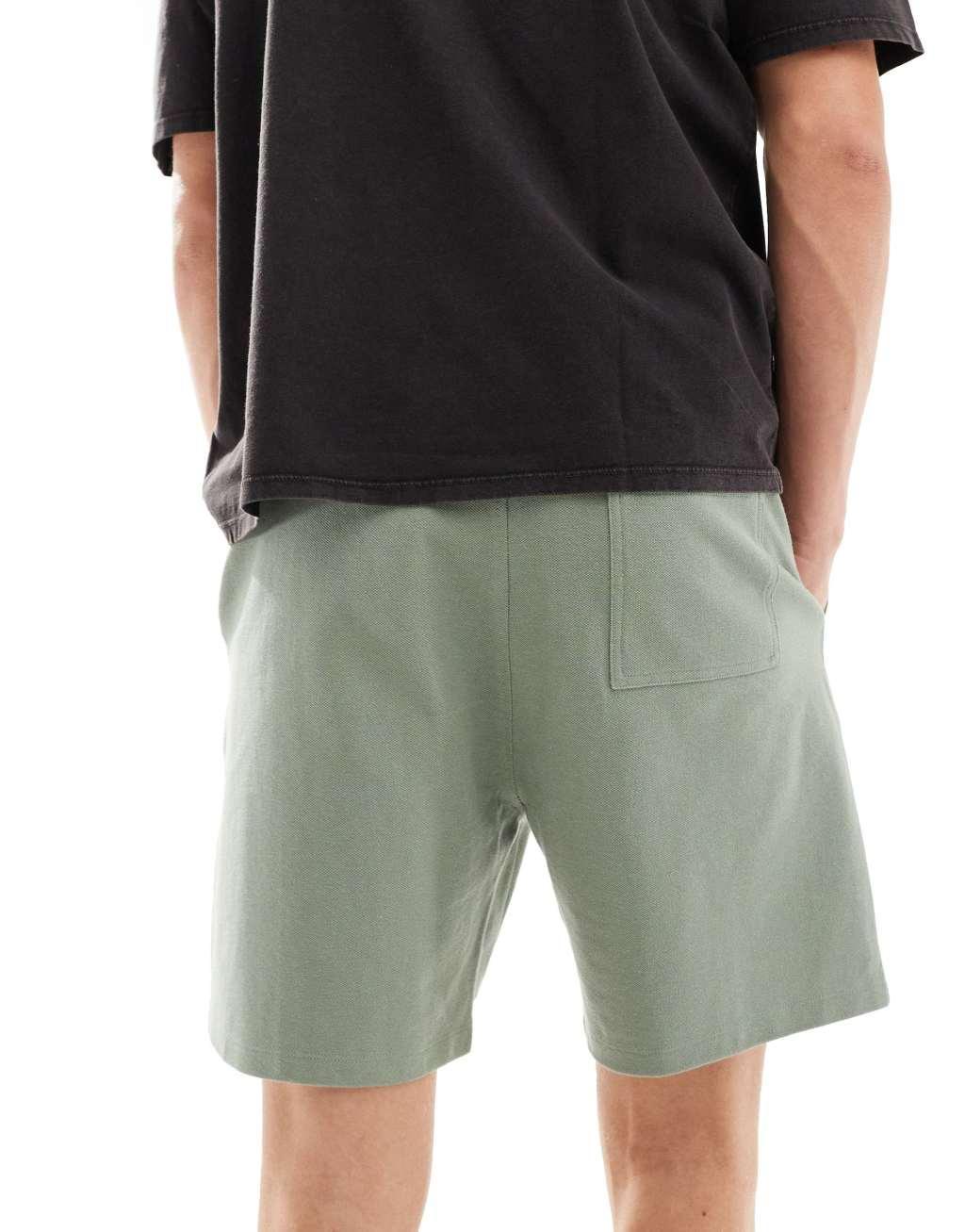 ASOS DESIGN slim pique shorts in mid green Product Image