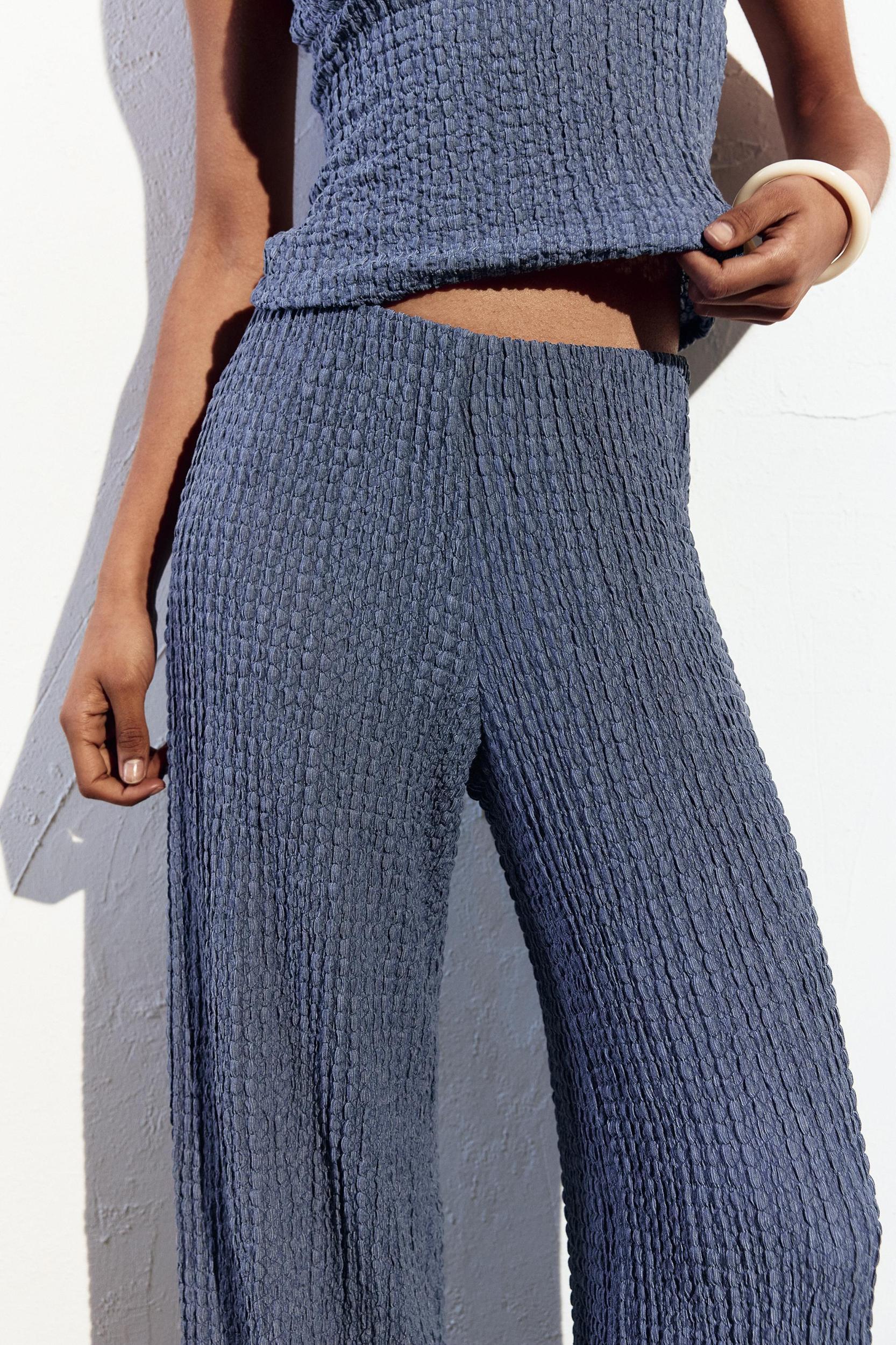 Rustic creased-effect pants Product Image