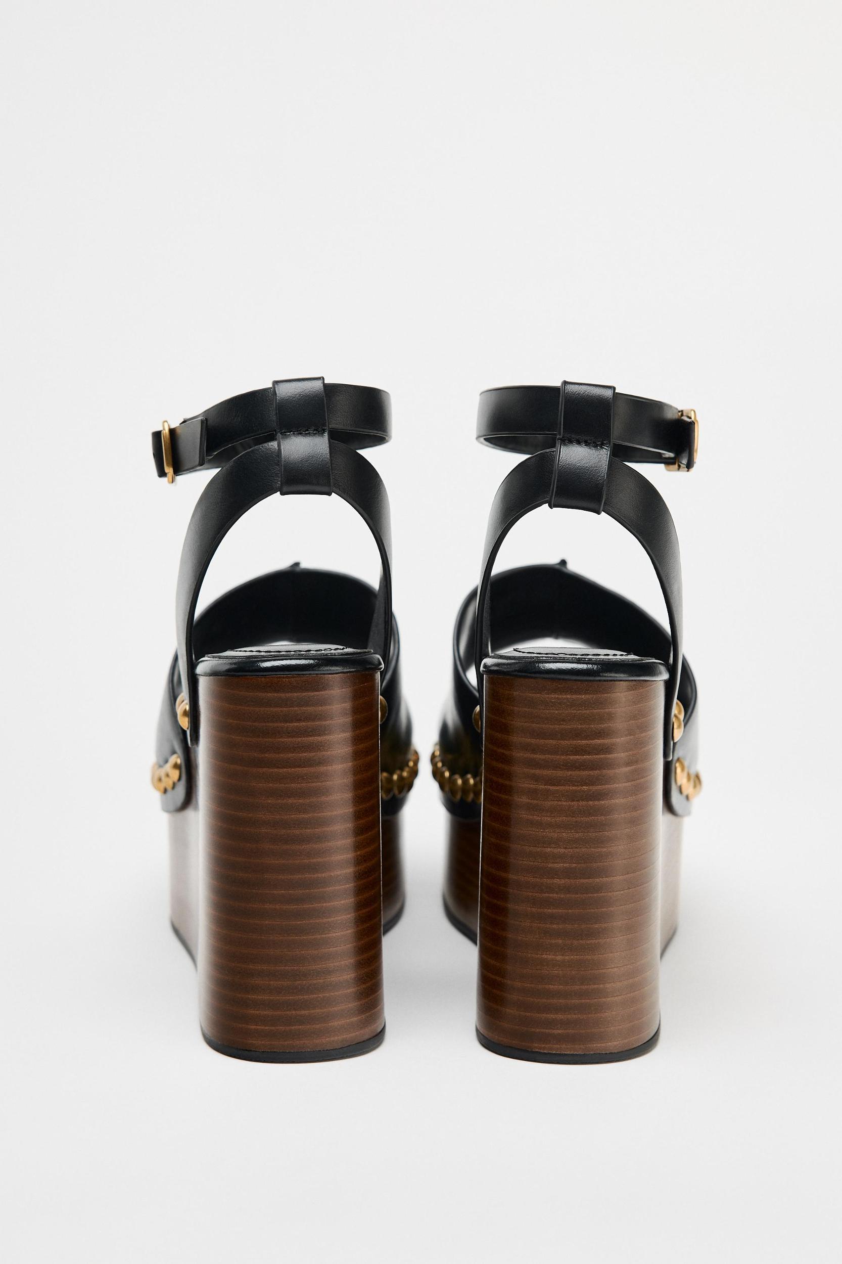 STUDDED LEATHER WEDGE SANDALS Product Image