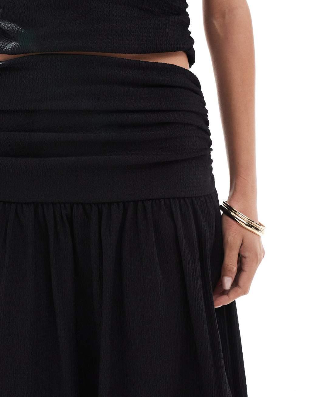 ASOS DESIGN textured ruched sides drop waist maxi skirt with slit front in black - part of a set Product Image