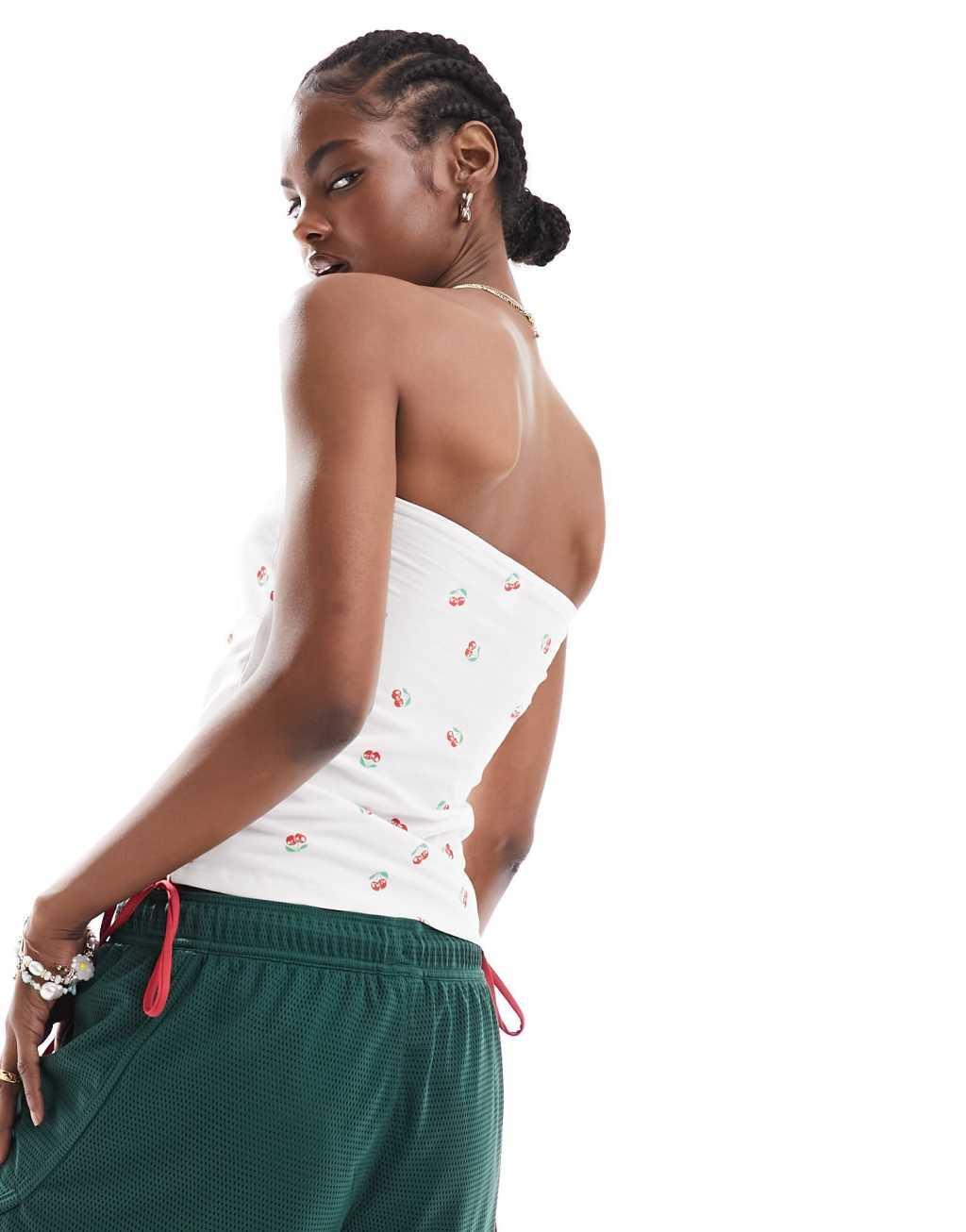 Monki strapless bandeau top in white and cherry print Product Image