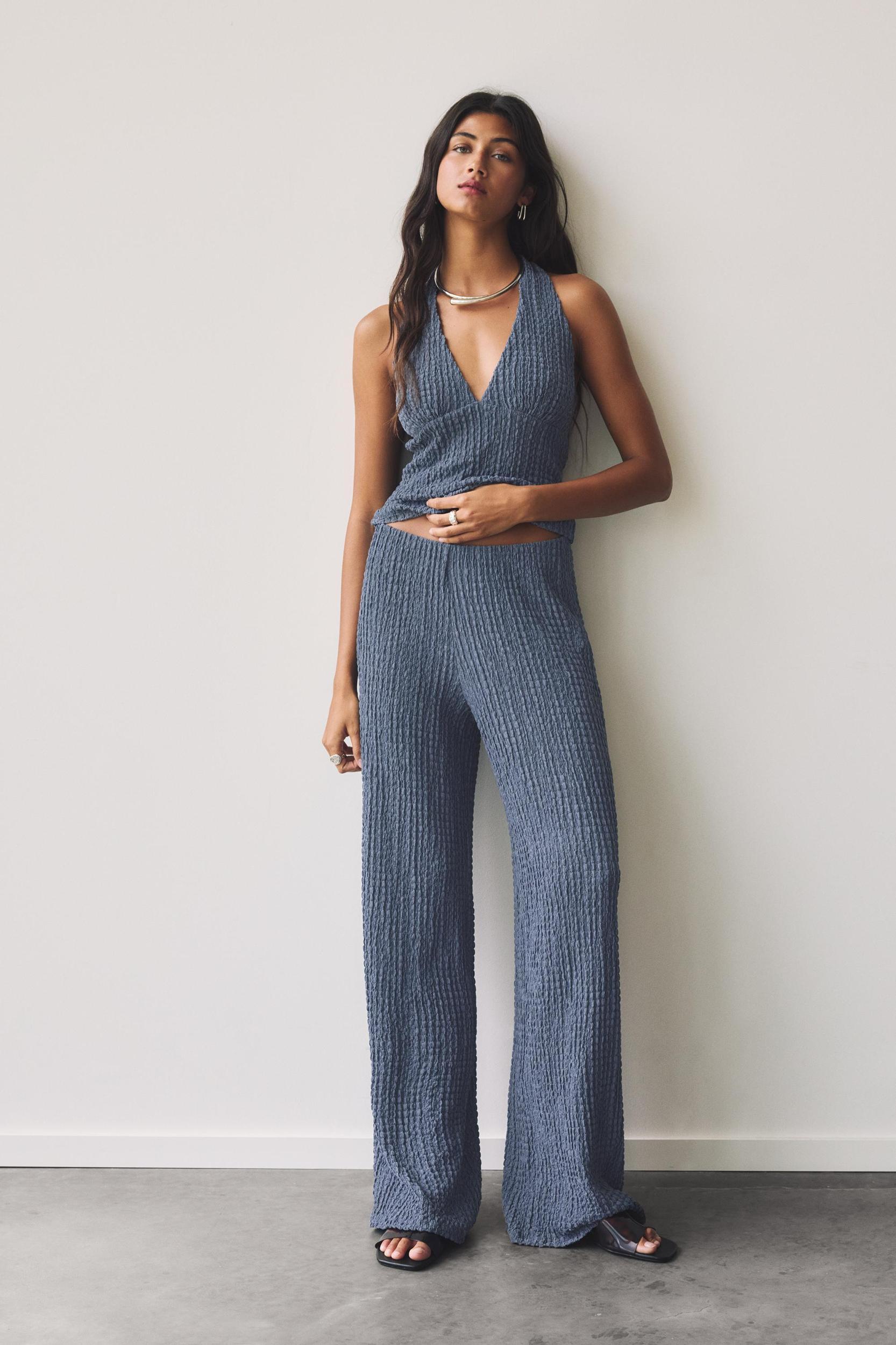 Rustic creased-effect pants Product Image