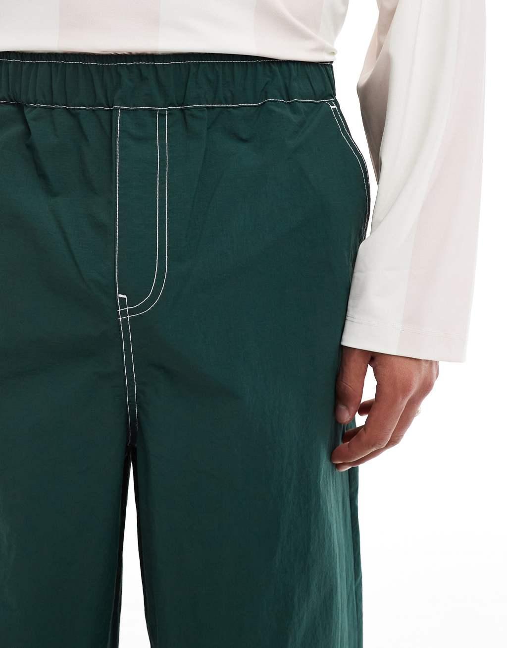 ASOS DESIGN baggy pants in green nylon with contrast stitch Product Image