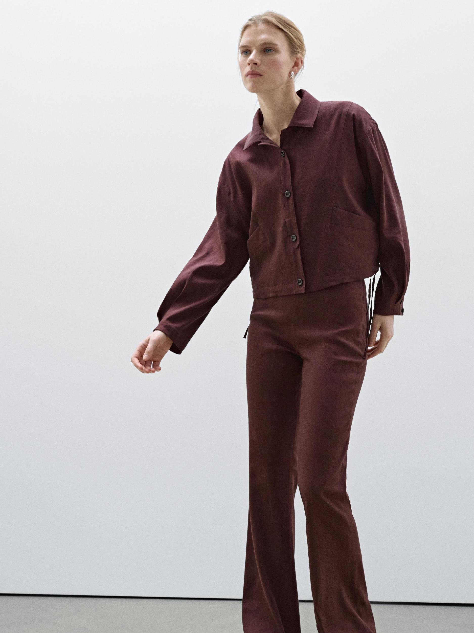 Flowing linen blend flared trousers Product Image