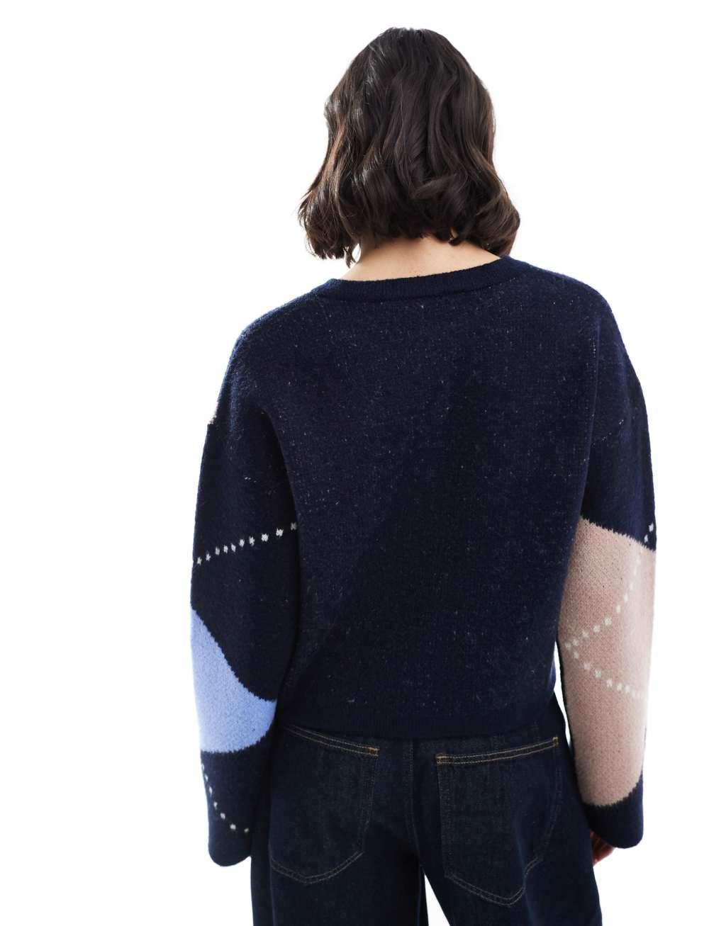 ASOS DESIGN knitted crew neck cardigan with gold button in navy argyle pattern Product Image