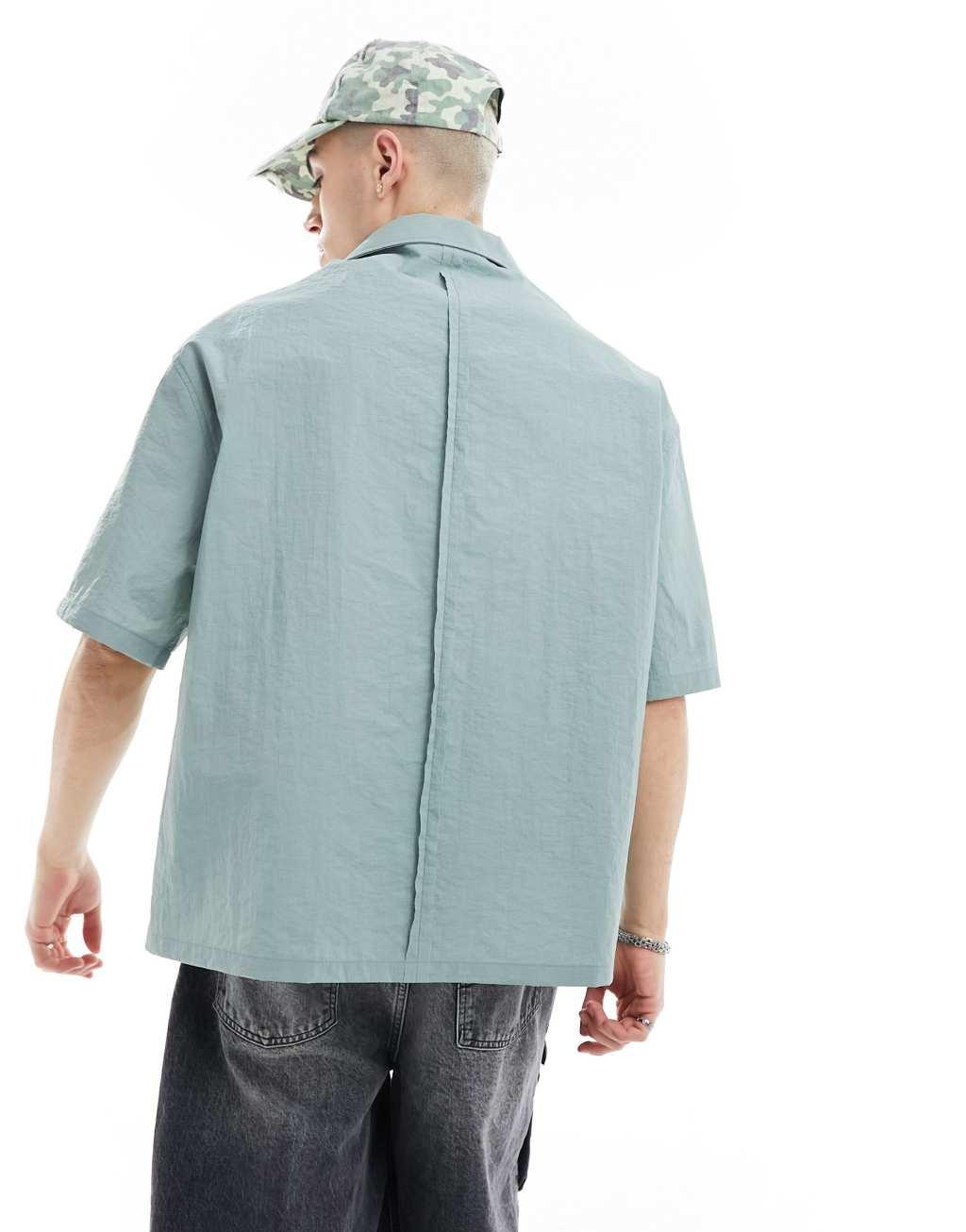 COLLUSION techy short sleeve revere shirt with raw seam detail in blue Product Image