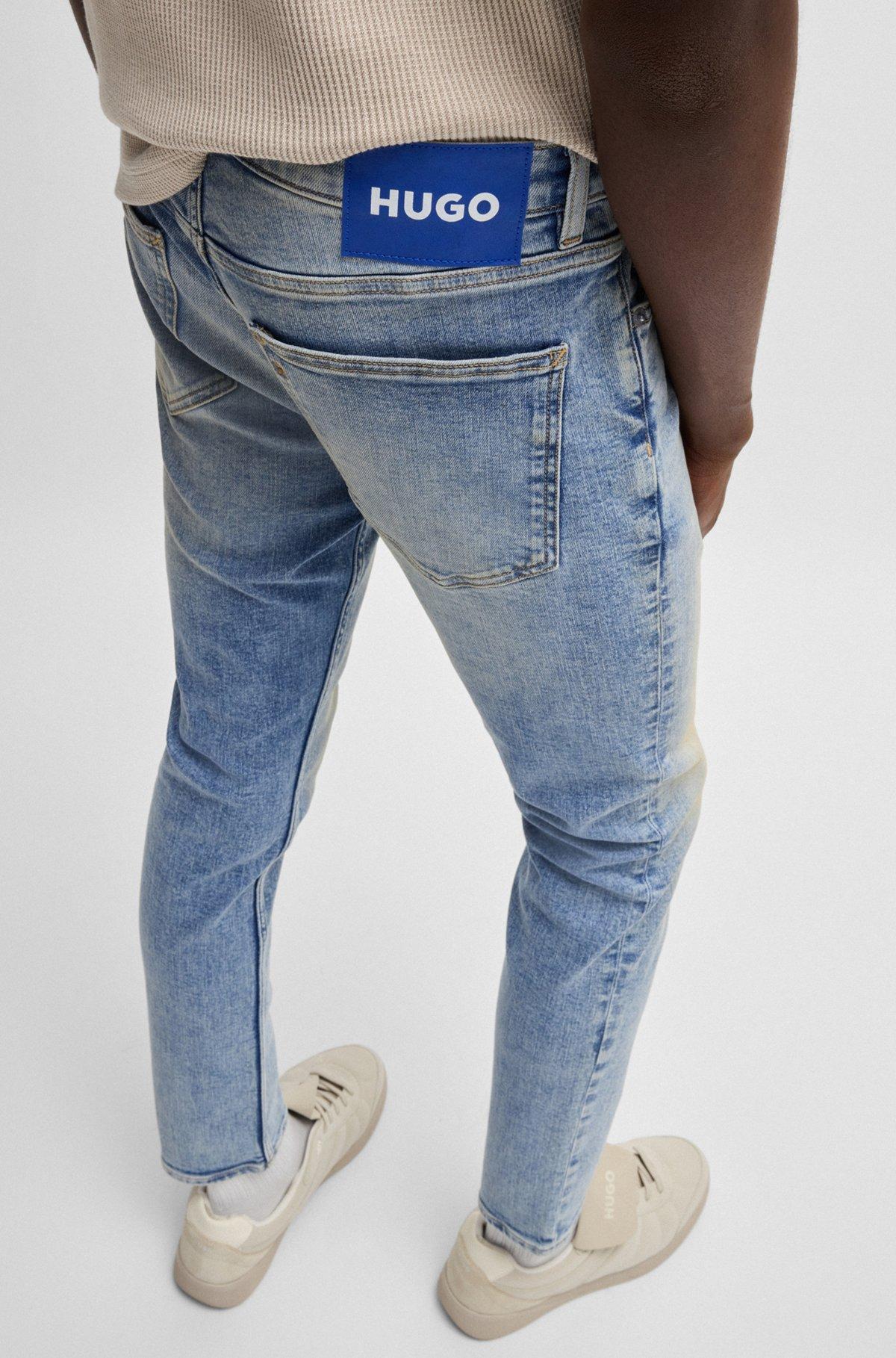 Extra-slim-fit jeans in stonewashed blue stretch denim Product Image