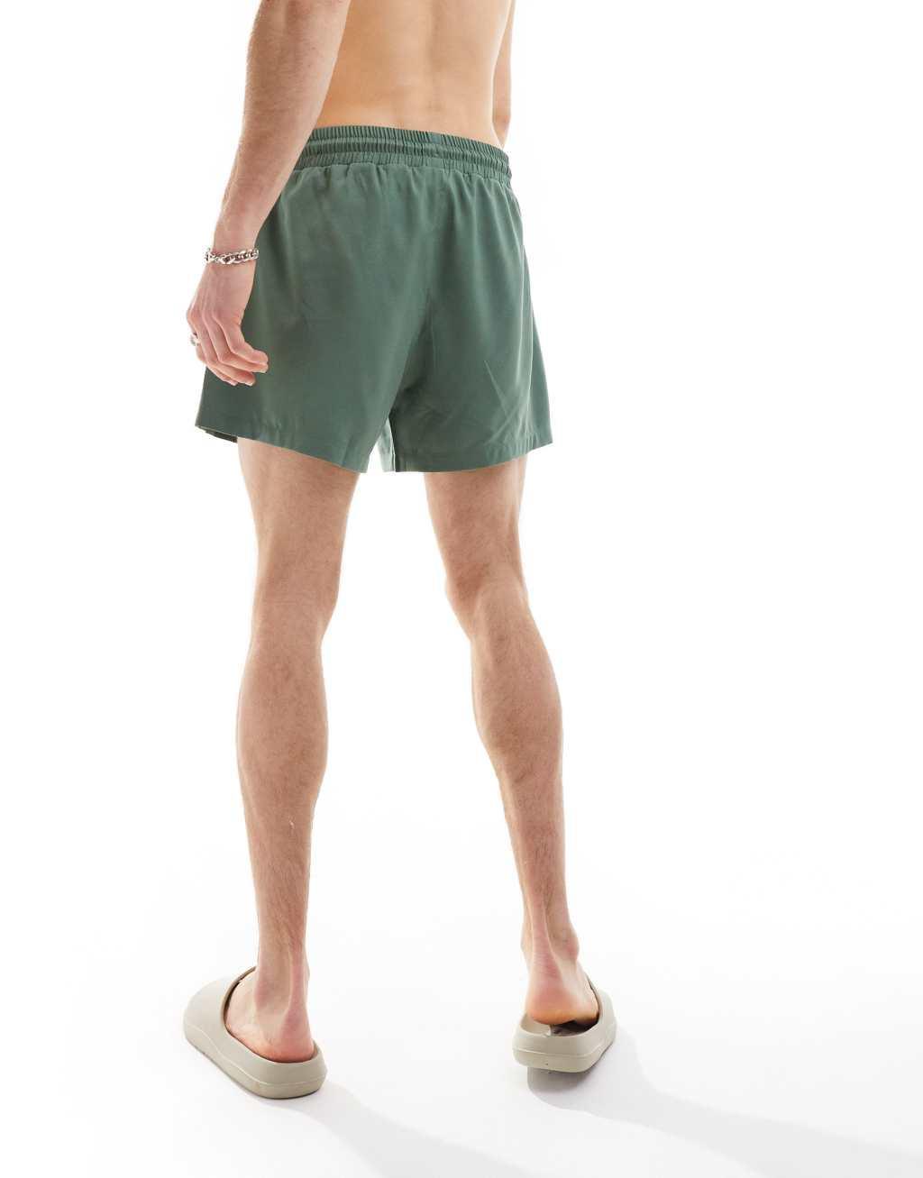 COLLUSION shorter length swim shorts in khaki Product Image