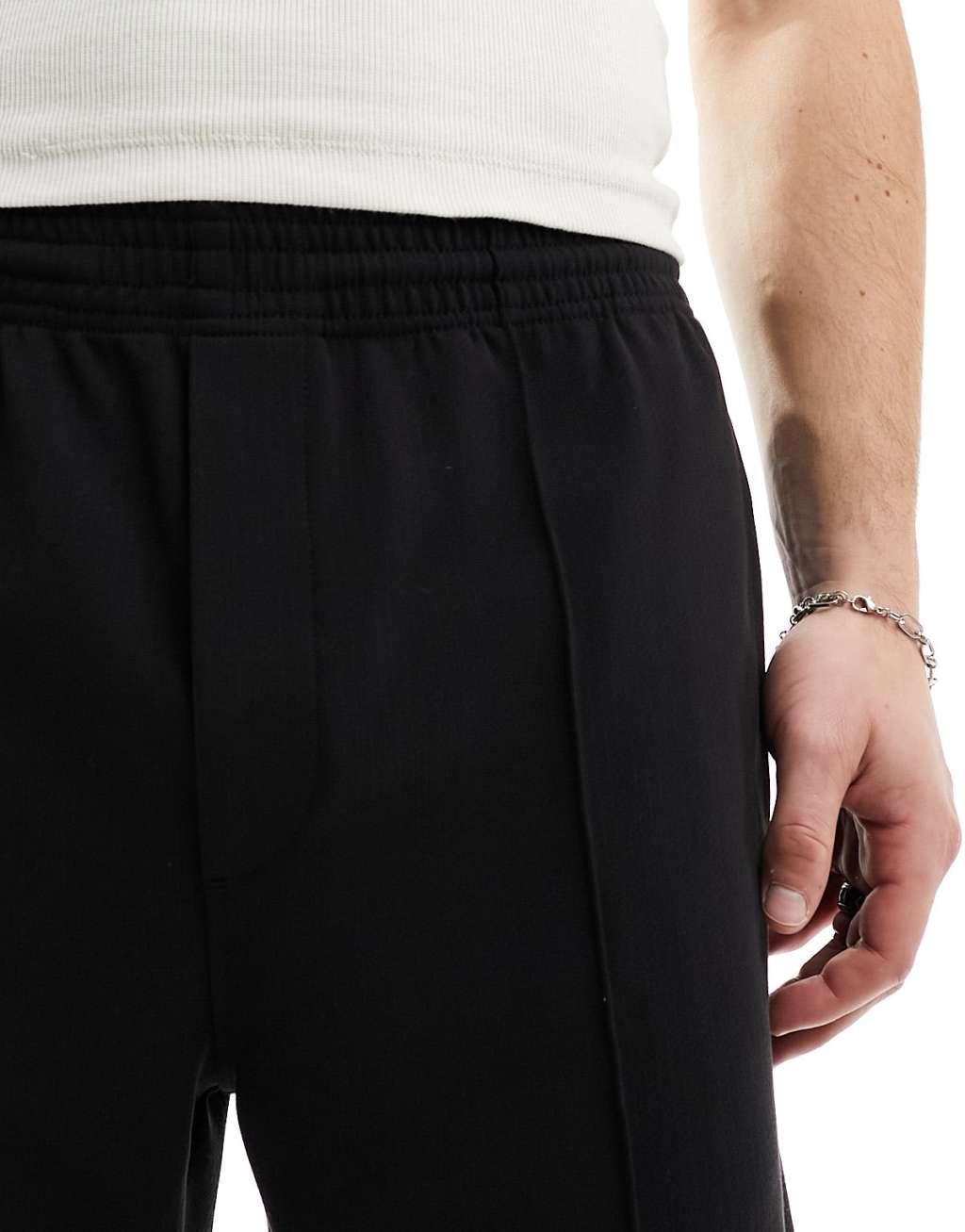 Weekday Ken relaxed fit shorts in black Product Image