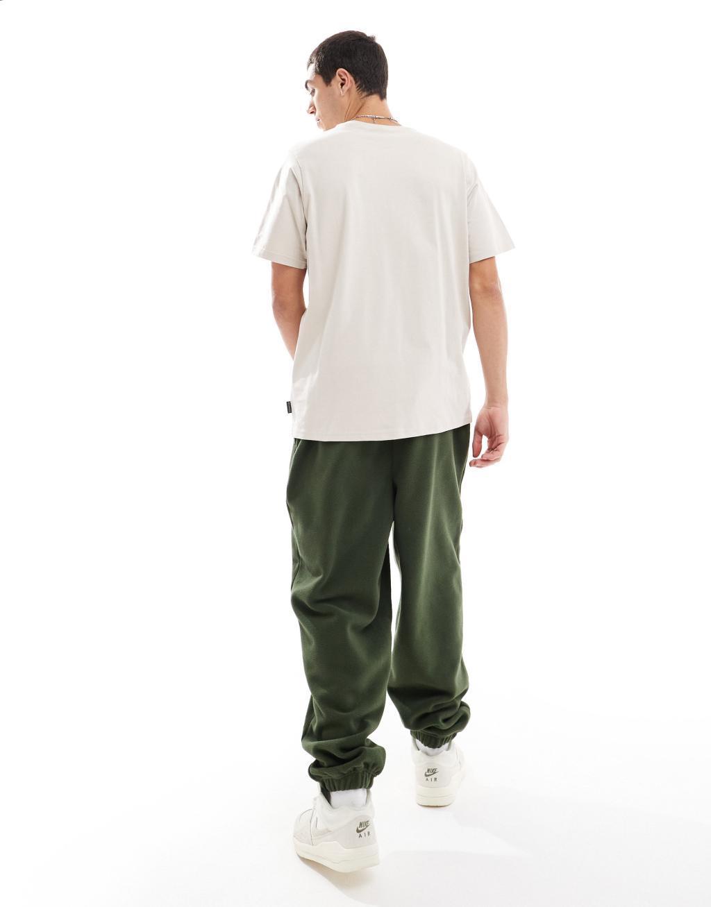 ASOS DESIGN oversized fleece sweatpants in green Product Image