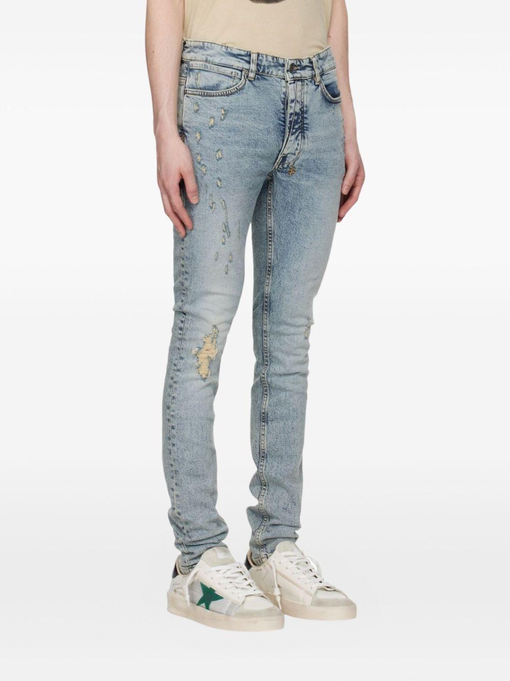 distressed logo-patch jeans Product Image