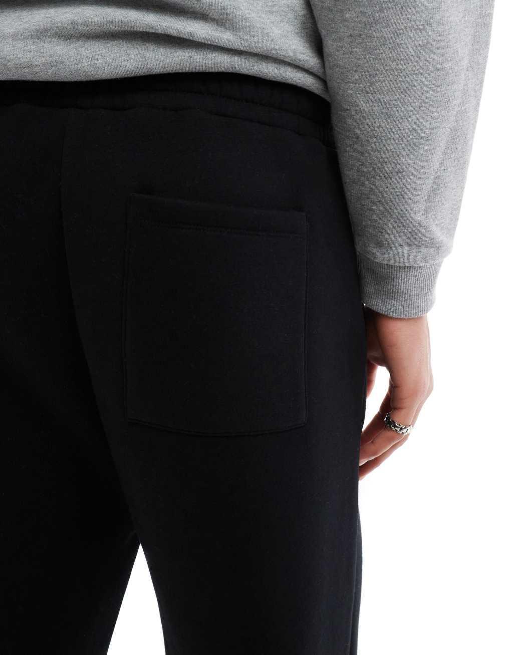 ASOS DESIGN oversized balloon sweatpants with pleat in black Product Image