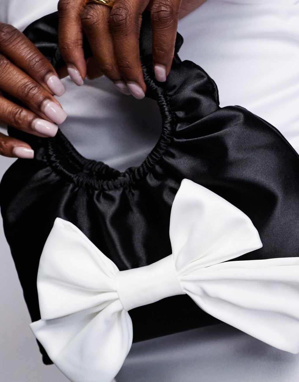 True Decadence bow front satin bag in black & white Product Image