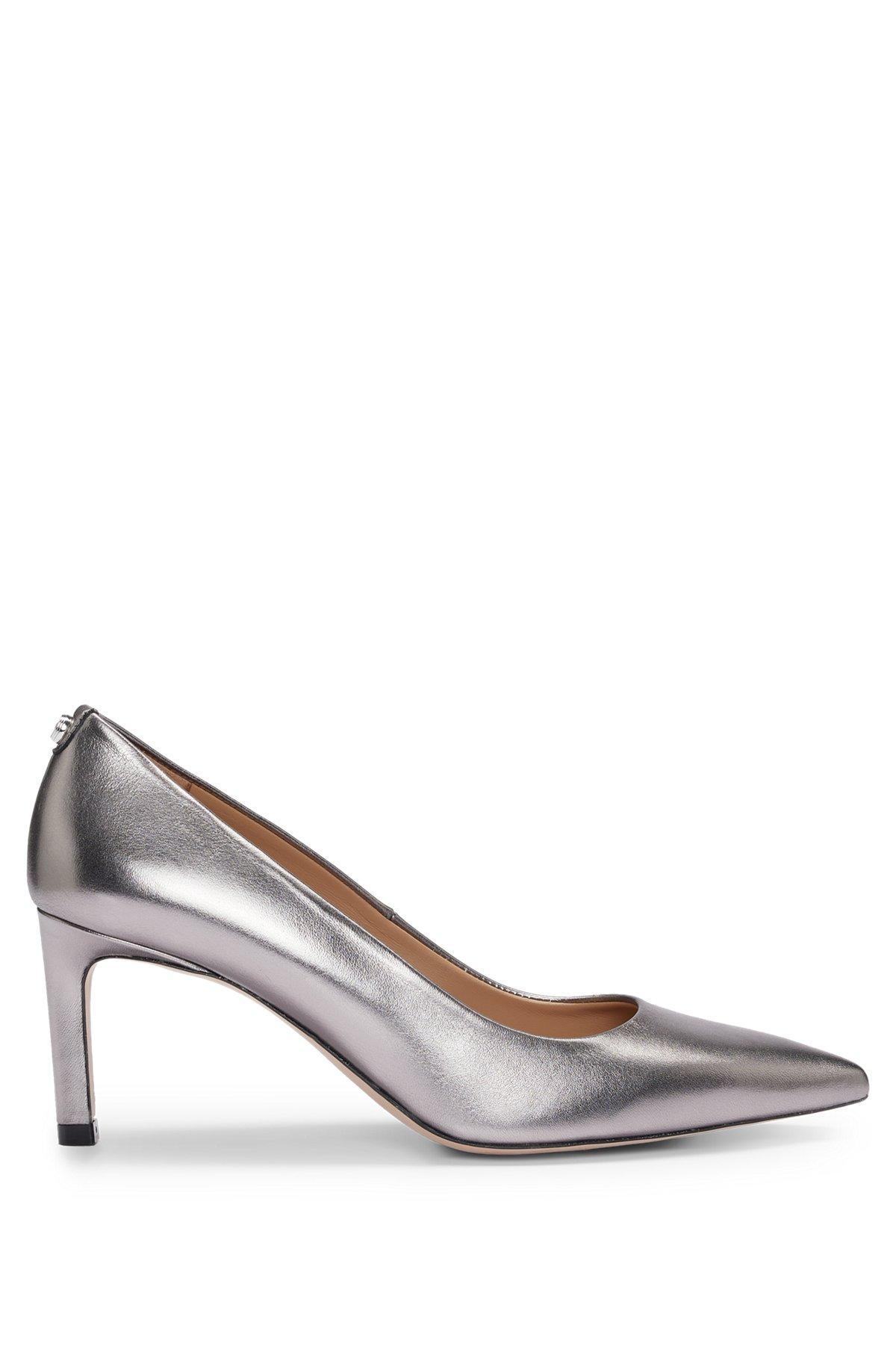 Heeled pumps in laminated leather Product Image