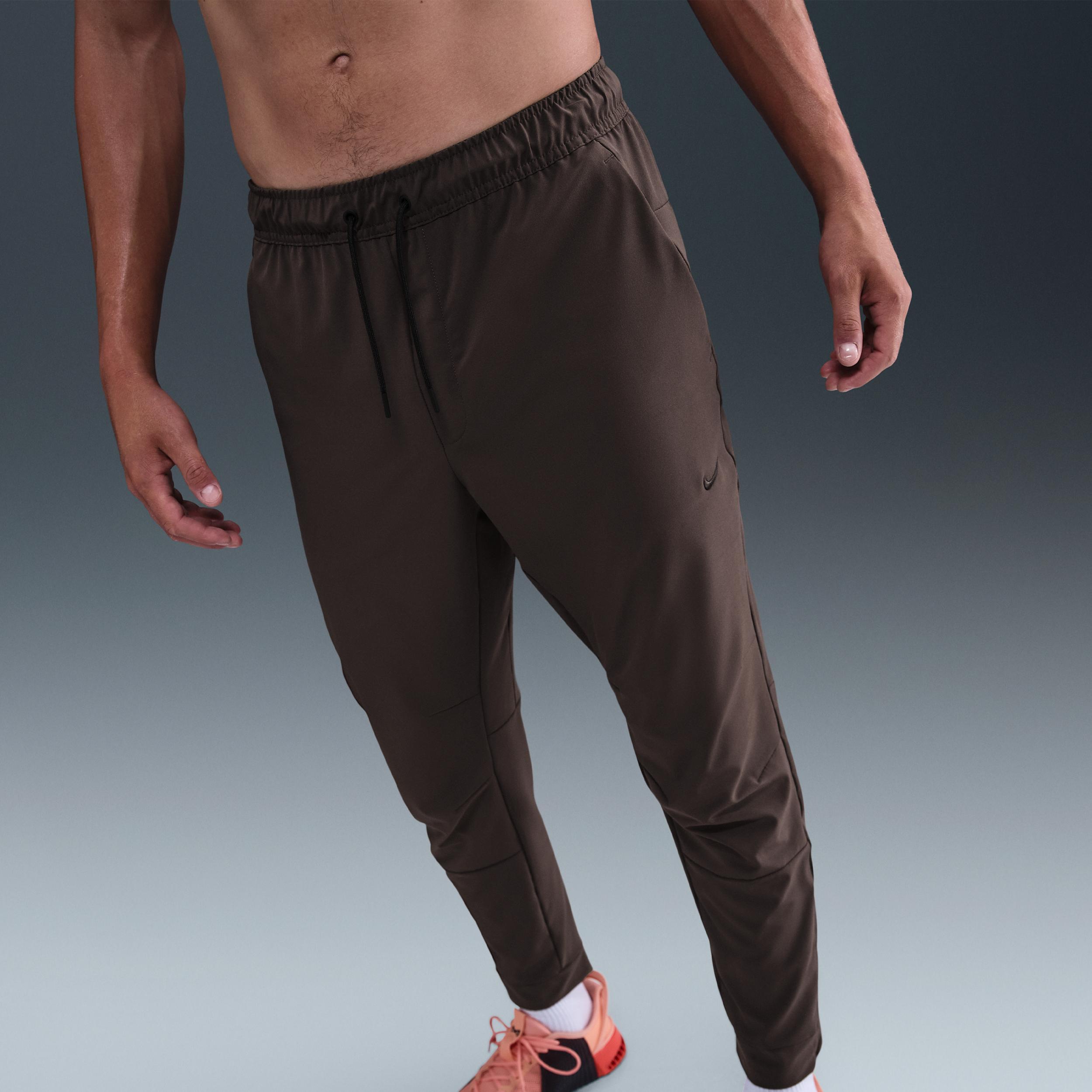 Nike Mens Unlimited Dri-FIT Zippered Cuff Versatile Pants | FB7548-237 Product Image