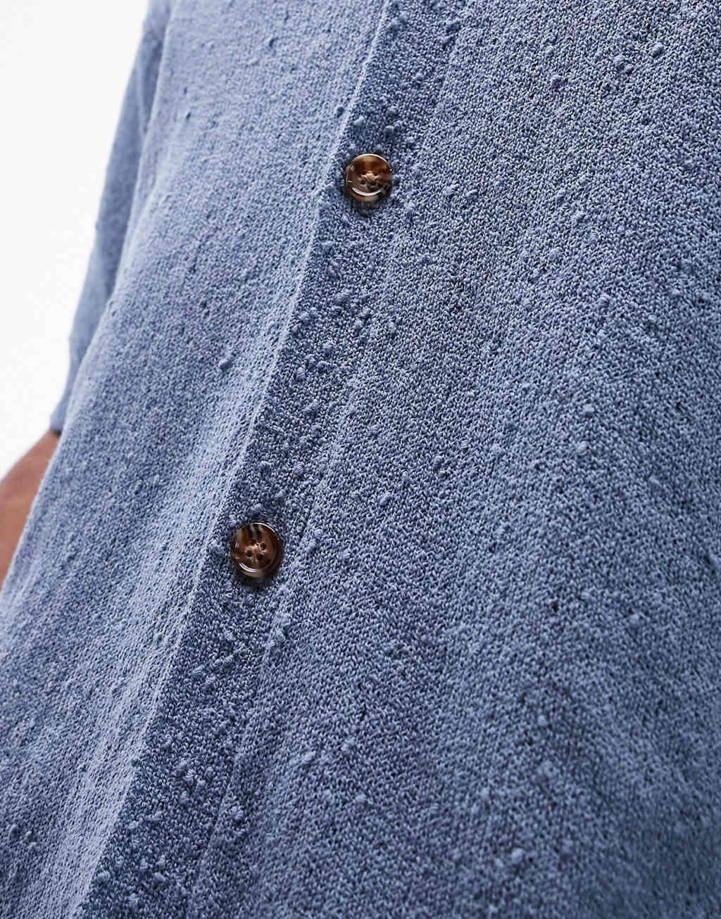 Topman nibbled knit button up polo in blue Product Image