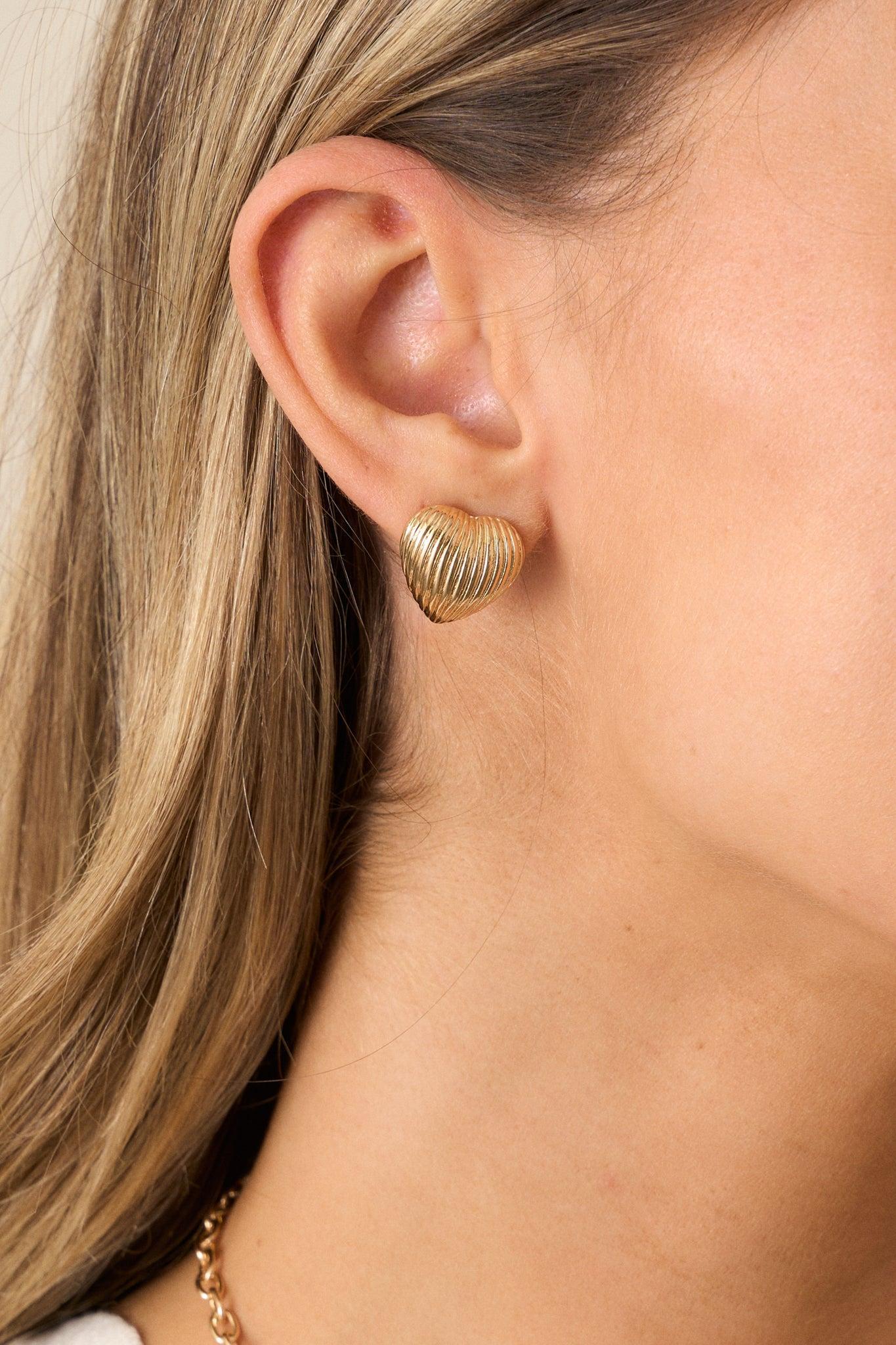 The Whispering Chasm Gold Textured Heart Earrings Product Image