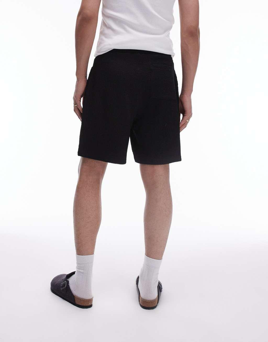 Topman oversized fit jersey shorts with crinkle plisse texture in black Product Image