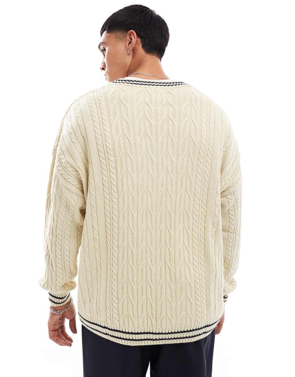 ASOS DESIGN oversized cable knit cricket sweater in cream with navy tipping Product Image