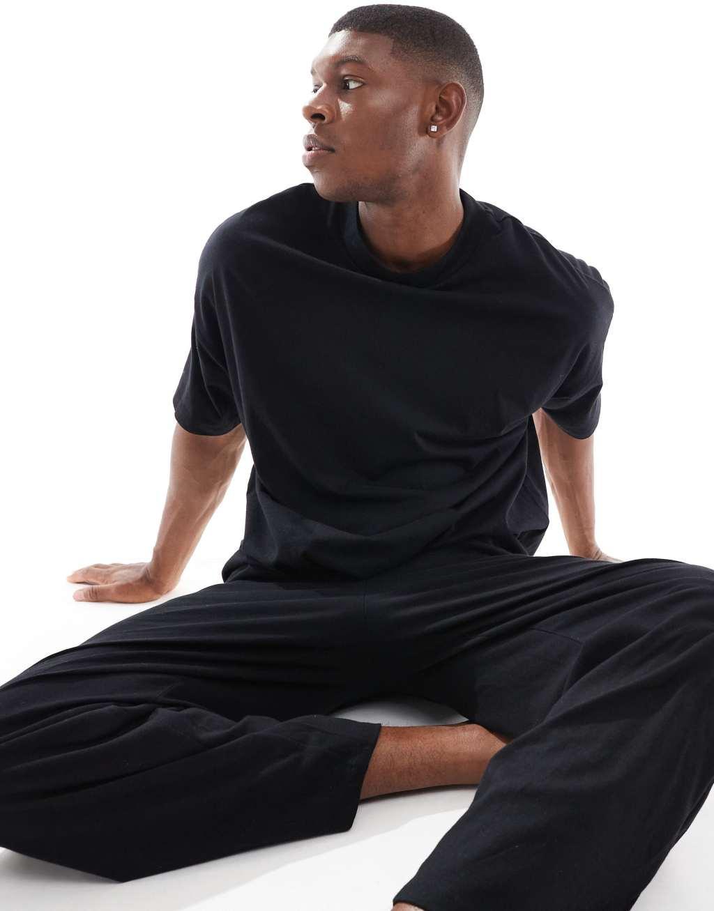 ASOS DESIGN jersey pajama set with oversized t-shirt and pants in black Product Image