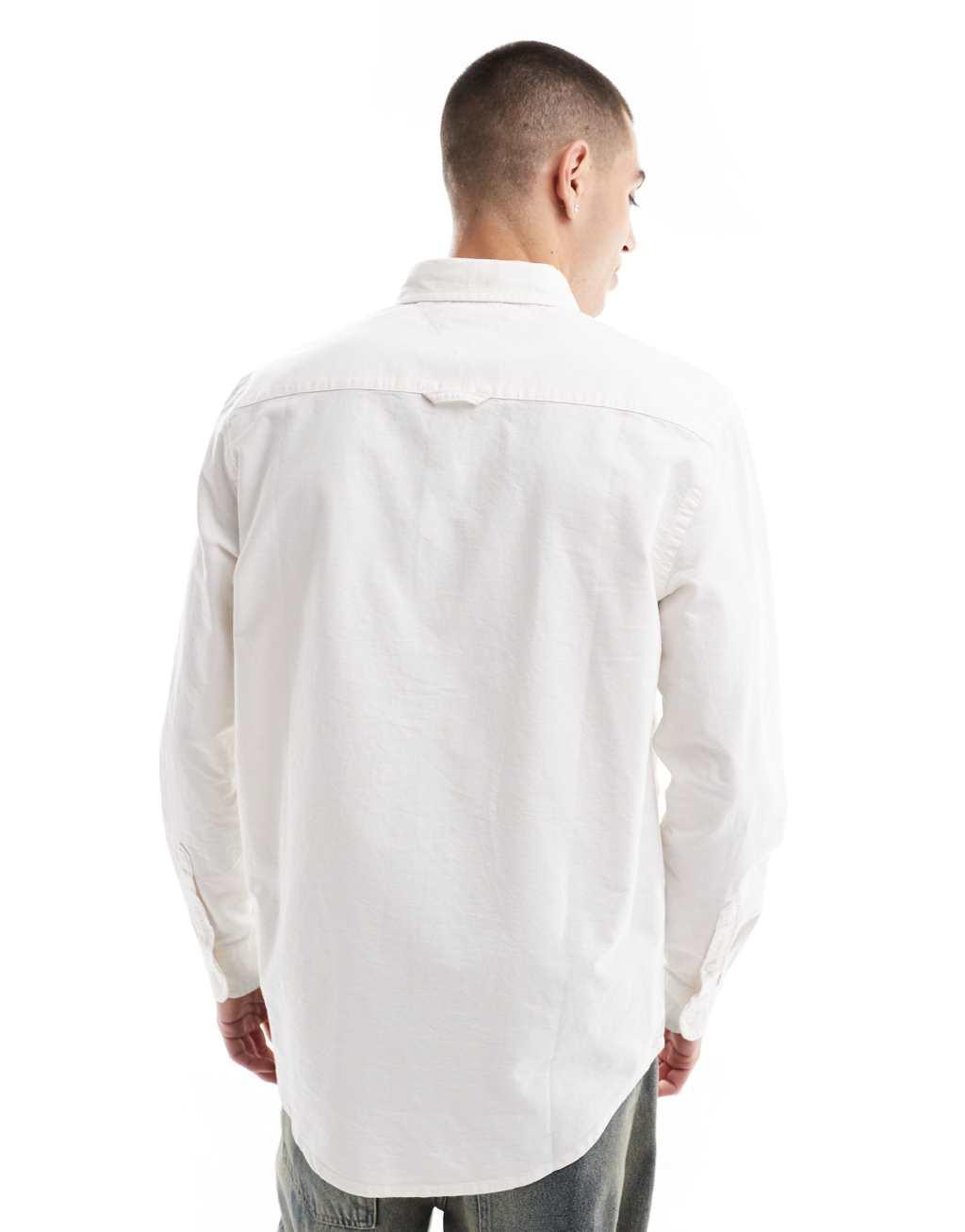 Tommy Jeans regular oxford shirt in white Product Image