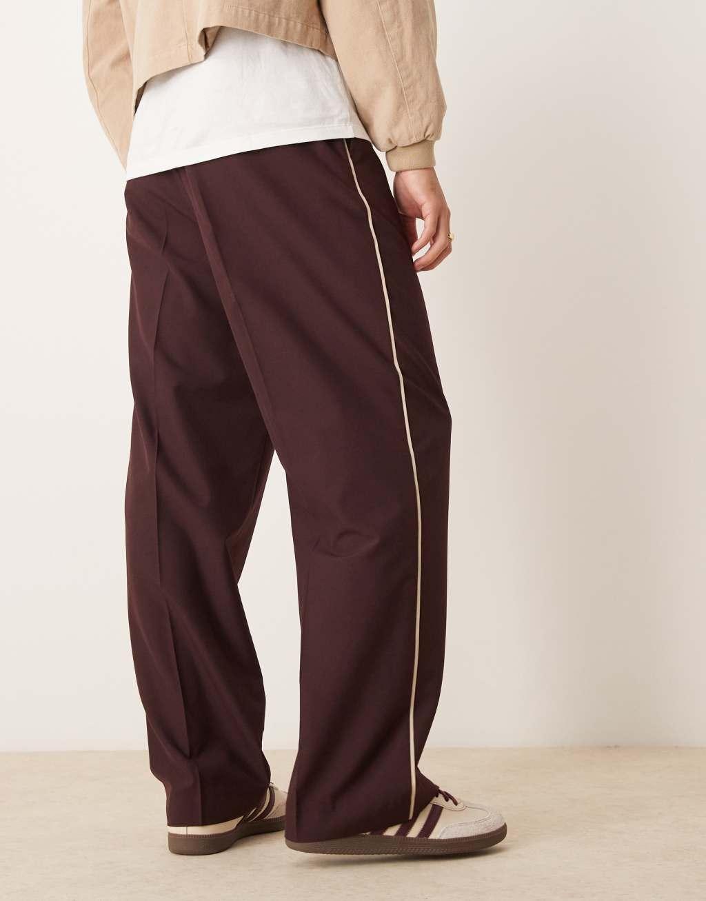 ASOS DESIGN pull on smart wide leg pants with side piping in burgundy Product Image