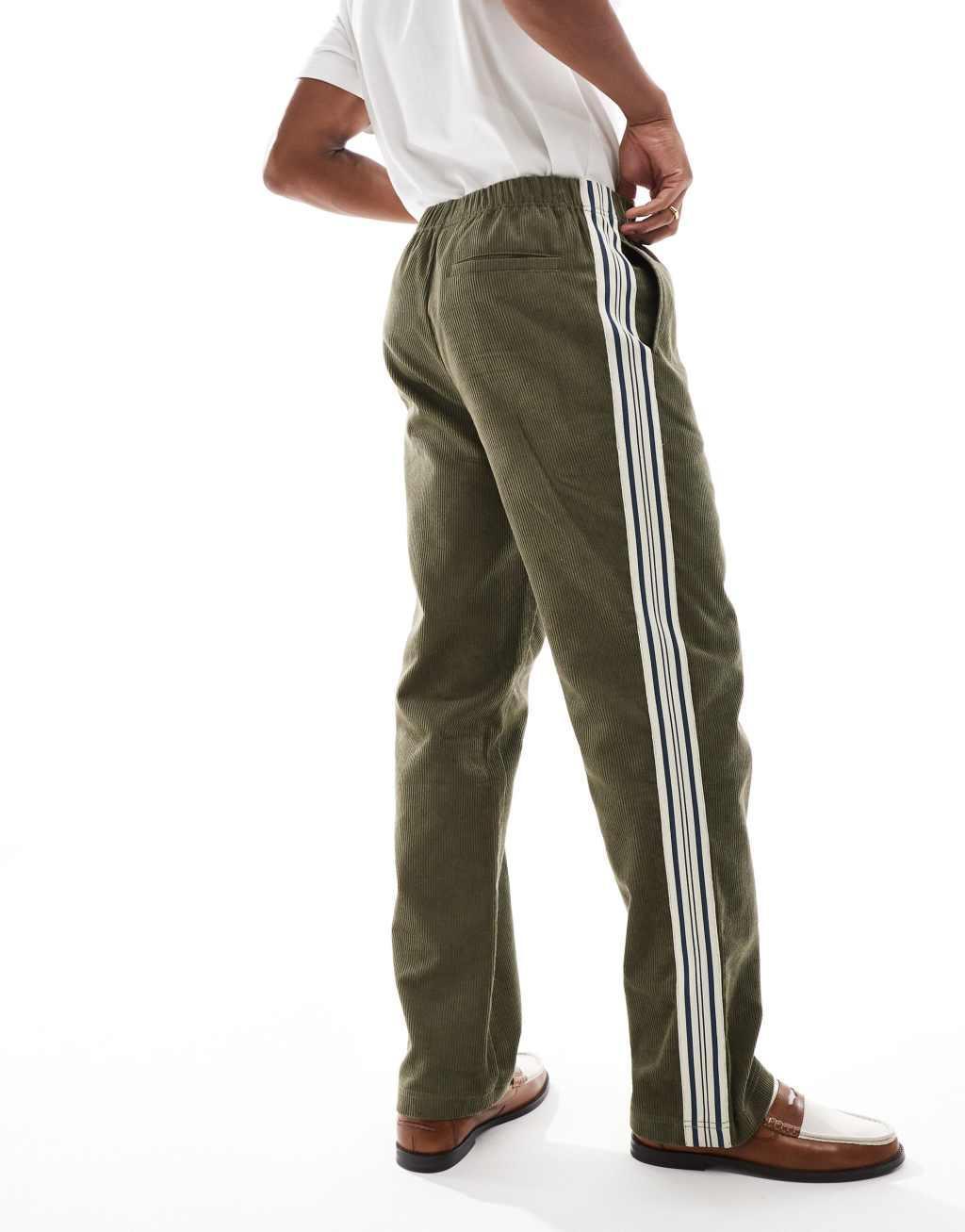 ASOS DESIGN pull on relaxed pants in green corduroy with stripe detail Product Image