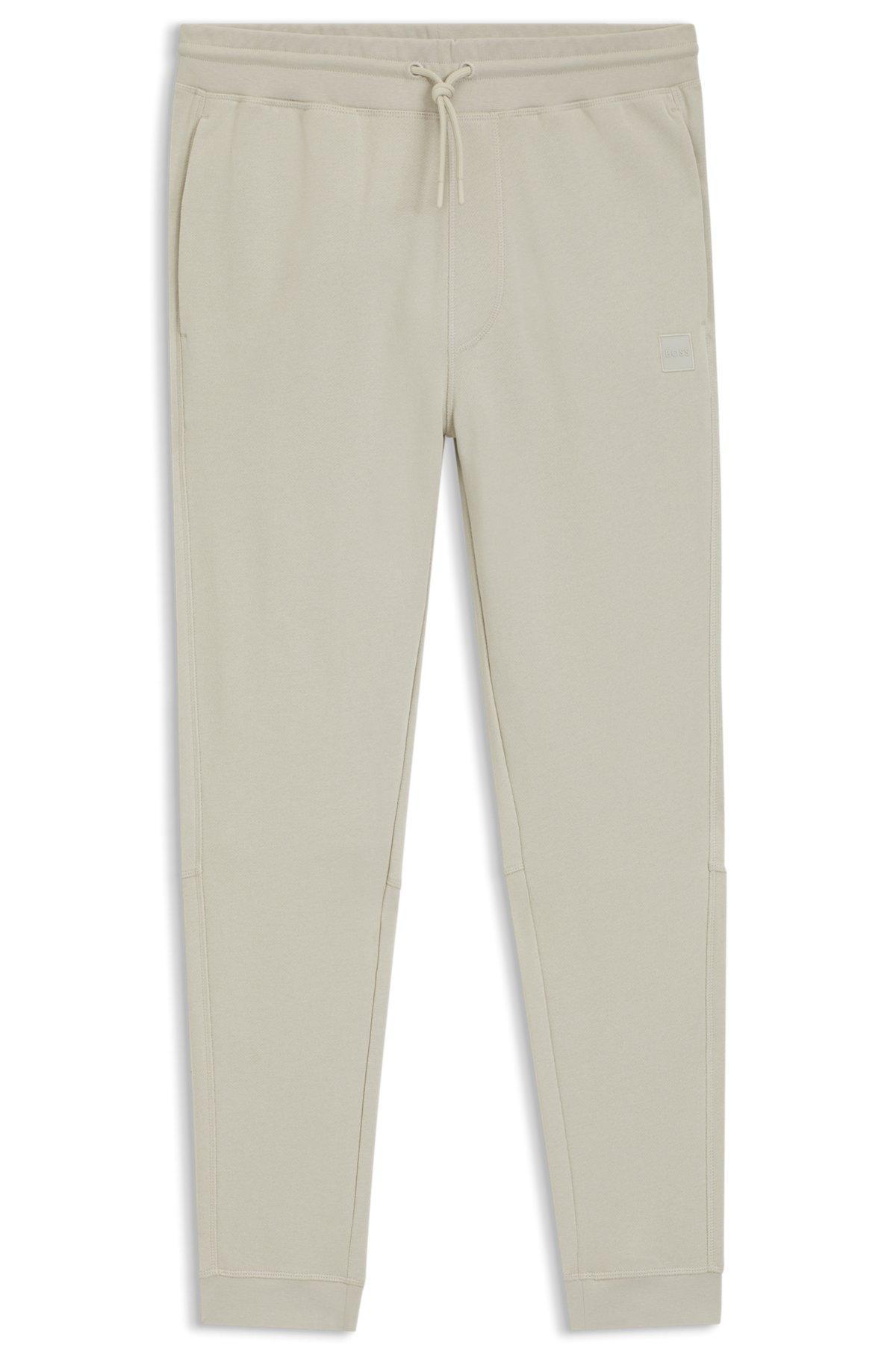 Cotton-terry tracksuit bottoms with logo patch Product Image