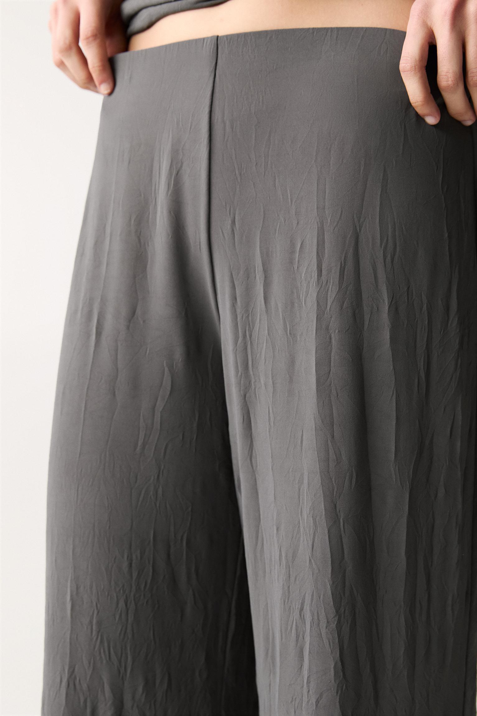 Creased-effect flared pants Product Image
