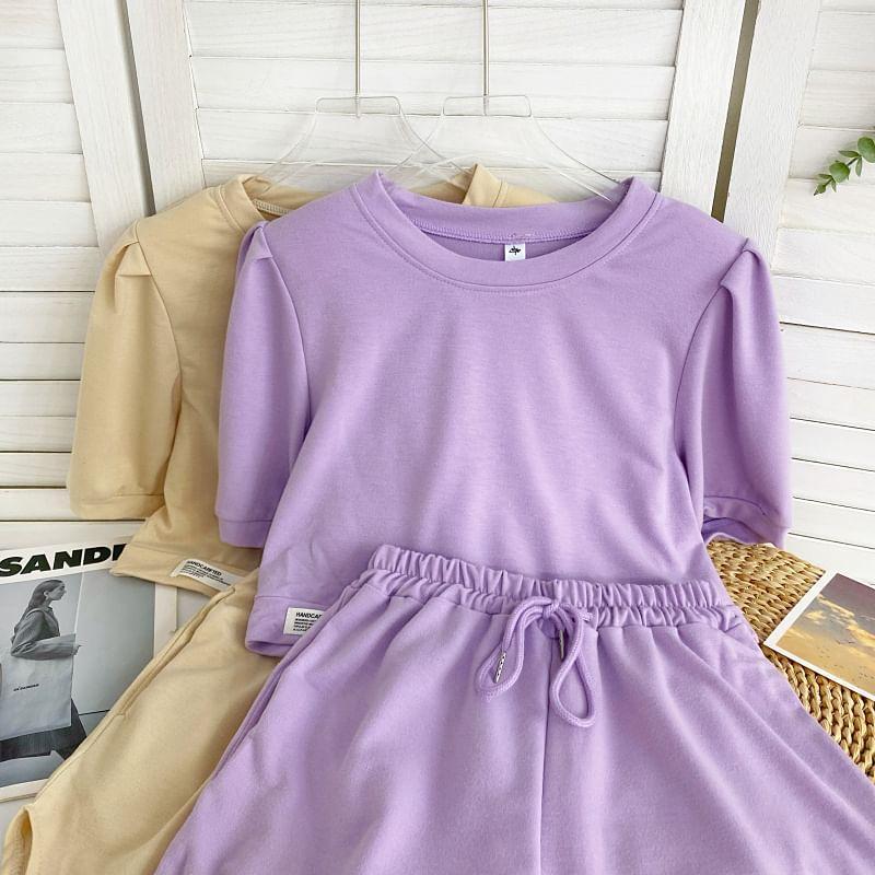 Set: Short-Sleeve Round Neck Plain Asymmetrical Tee + Drawstring Waist Sweat Shorts Product Image