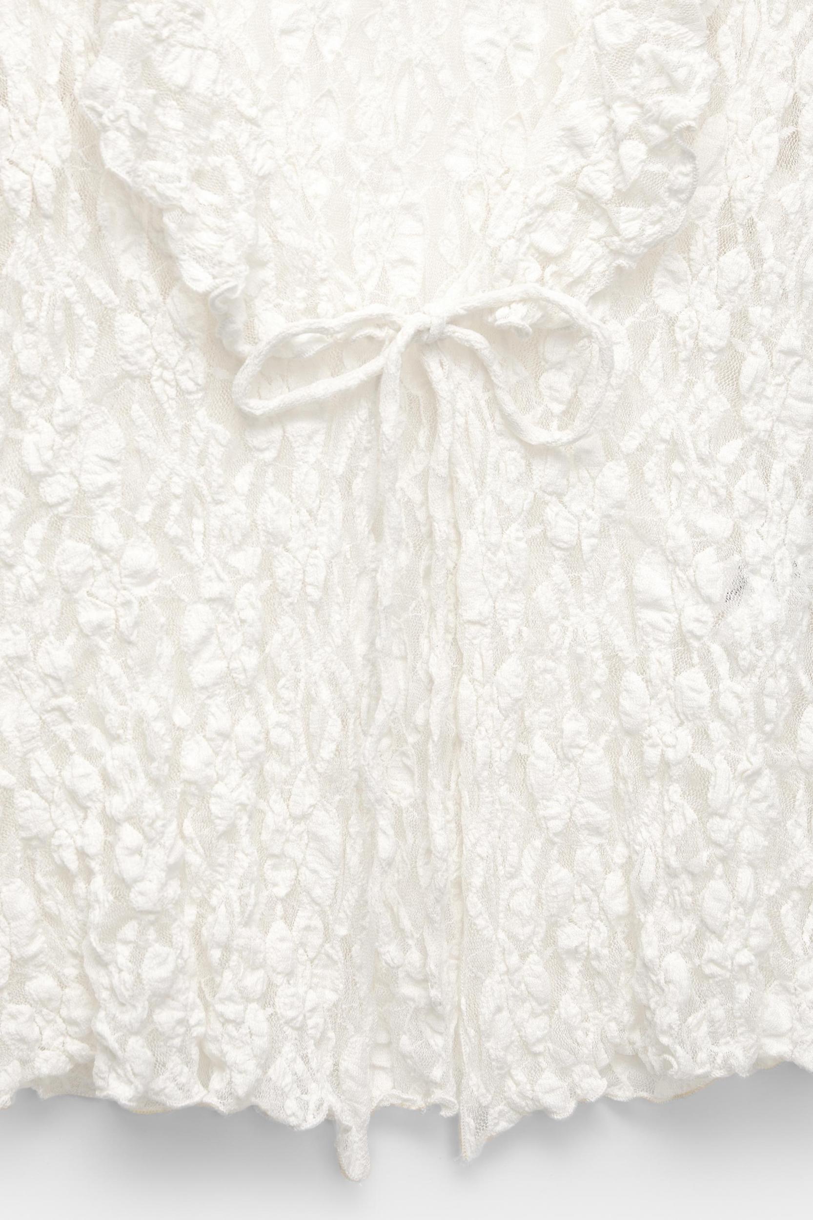 Lace blouse with ruffles Product Image