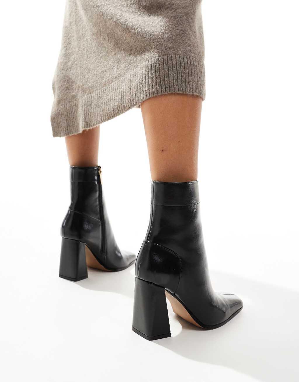 ASOS DESIGN Everest flared heel boots in black Product Image