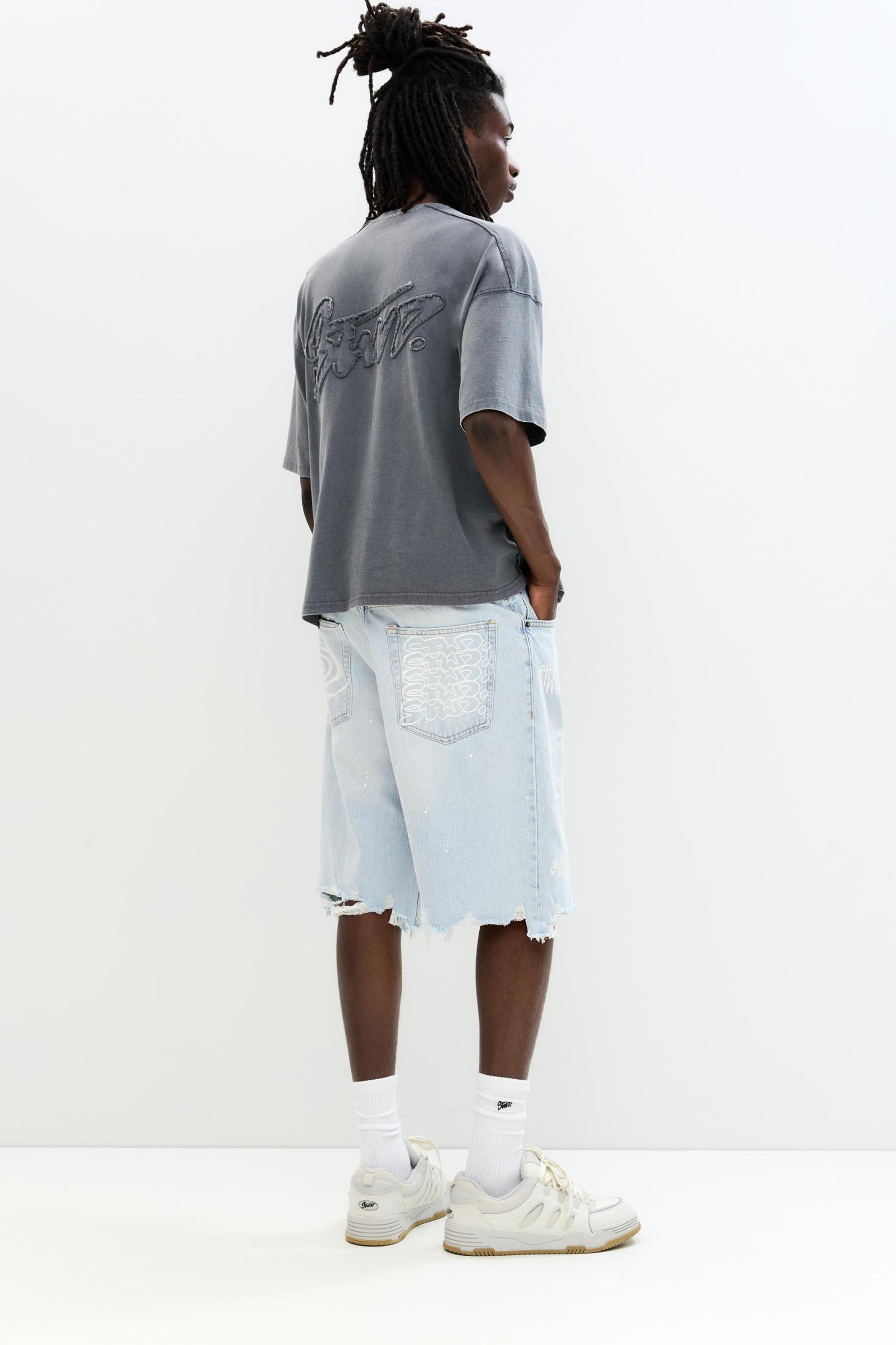 Ripped denim Bermuda shorts Product Image